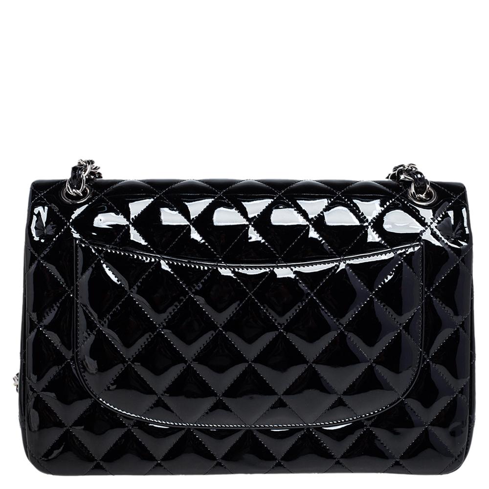 We're bringing Chanel's iconic Classic Flap bag to your closet with this creation. Beautifully crafted from patent leather and covered in the diamond quilt, it bears the signature label within the leather interior and the iconic CC turn-lock on the