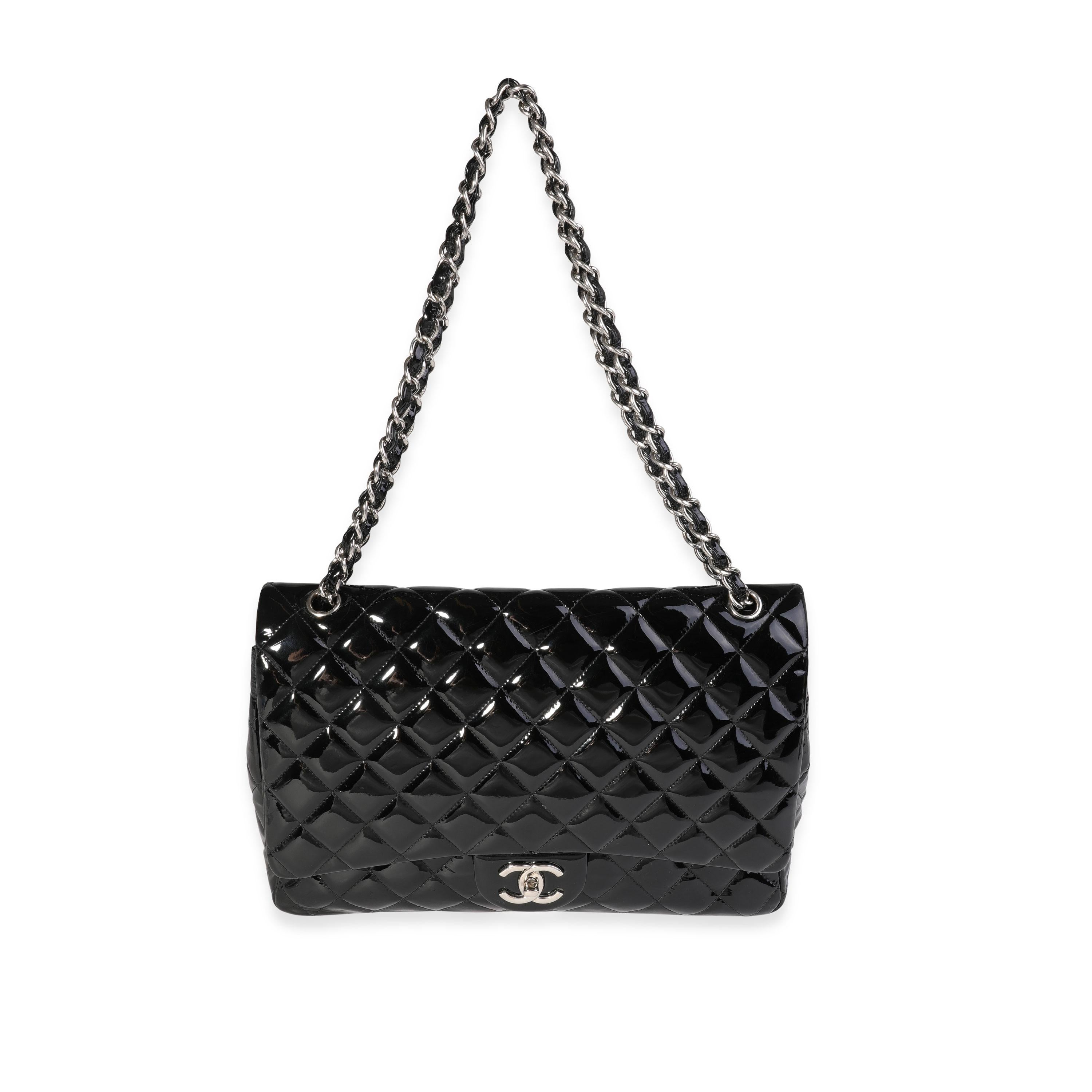 Listing Title: Chanel Black Quilted Patent Leather Maxi Classic Double Flap Bag
SKU: 121325
MSRP: 10000.00
Condition: Pre-owned 
Handbag Condition: Good
Condition Comments: Good Condition. Scuffing to corners and throughout exterior. Scratching to