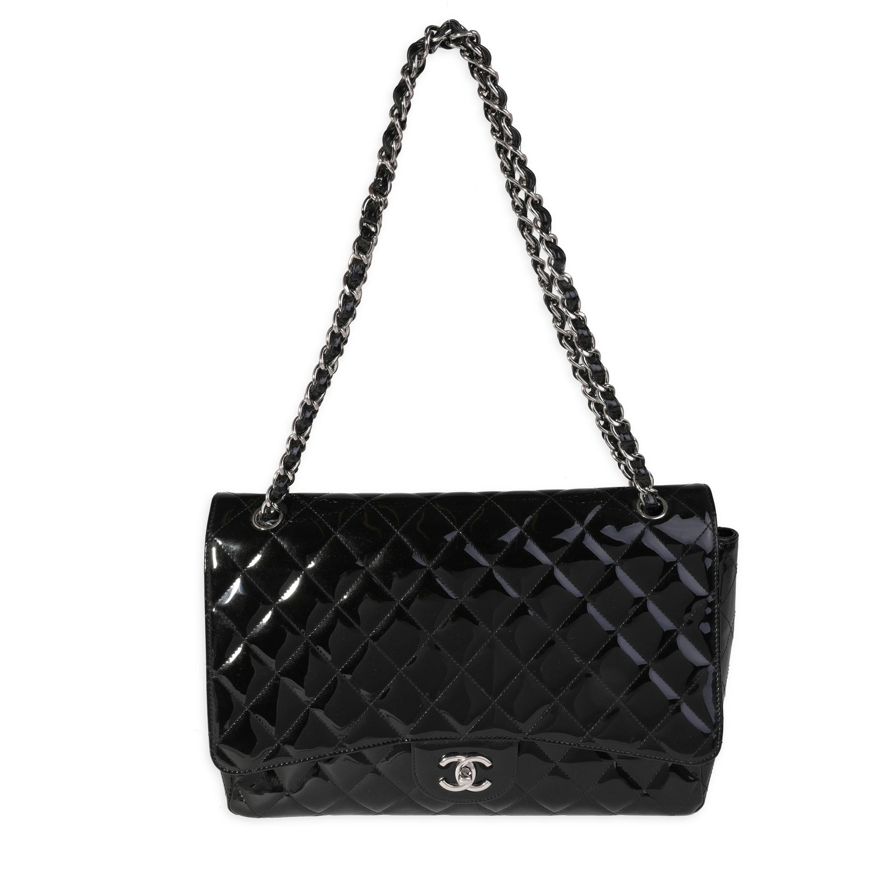 Listing Title: Chanel Black Quilted Patent Leather Maxi Classic Single Flap Bag
SKU: 121673
MSRP: 10000.00
Condition: Pre-owned 
Handbag Condition: Very Good
Condition Comments: Very Good Condition. Light scuffing to corners and throughout exterior.