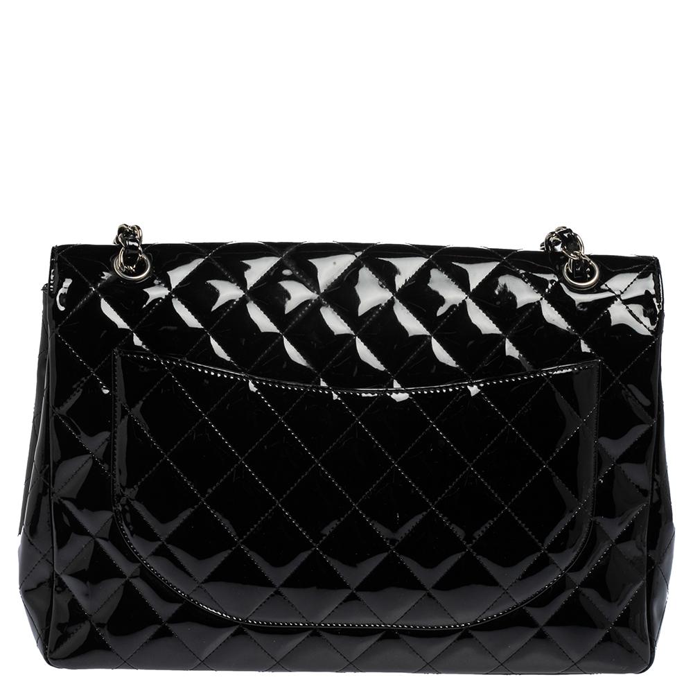 We're bringing Chanel's iconic Classic Flap bag to your closet with this creation. Beautifully crafted from patent leather and covered in the diamond quilt, it bears the signature label on the interior and the iconic CC turn-lock on the flap. The