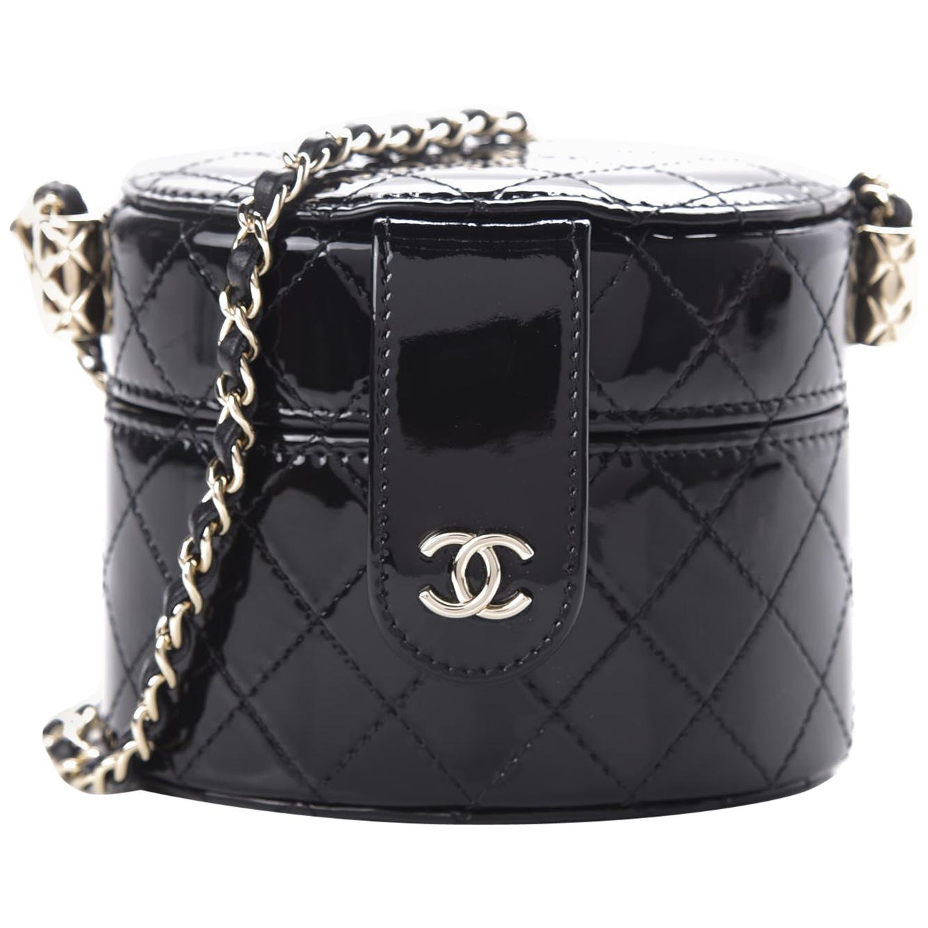 Chanel Micro Mini Black Quilted Patent Leather Jewelry Box Crossbody Bag

Patent leather
Black
Leather interwoven chain strap
Top lid opening with magnetic snap closure
Gold tone hardware
Fabric lining
Mirror on lid
Measurements: 4