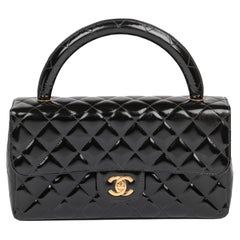 CHANEL Sac à rabat classique Kelly en cuir verni noir matelassé vintage de taille moyenne