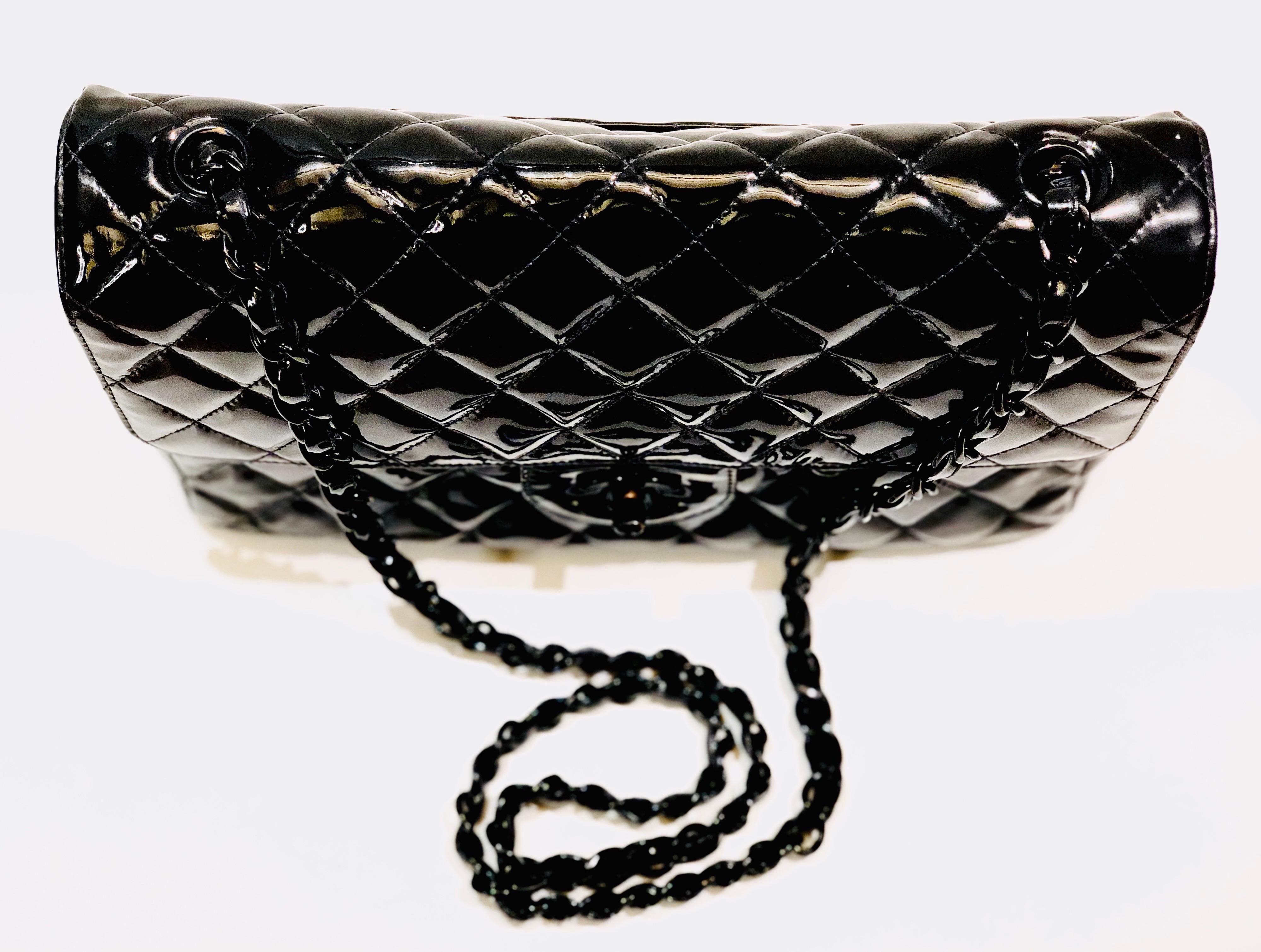 Women's Chanel black quilted patent with black hardware 