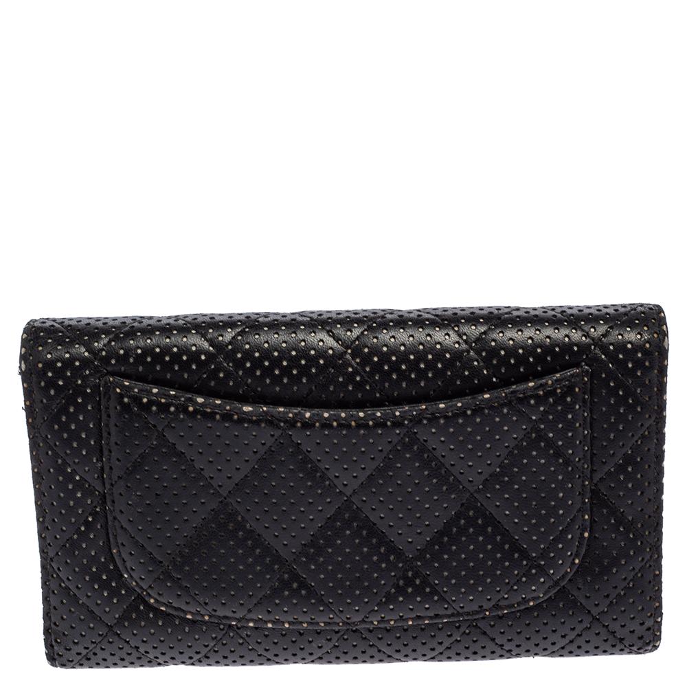 Carry this flap wallet by Chanel to keep your money sorted out! The exterior is made from black perforated leather in a quilted pattern and is coupled with a flap showcasing a CC logo and opens with a snap button fastening. This wallet has a back