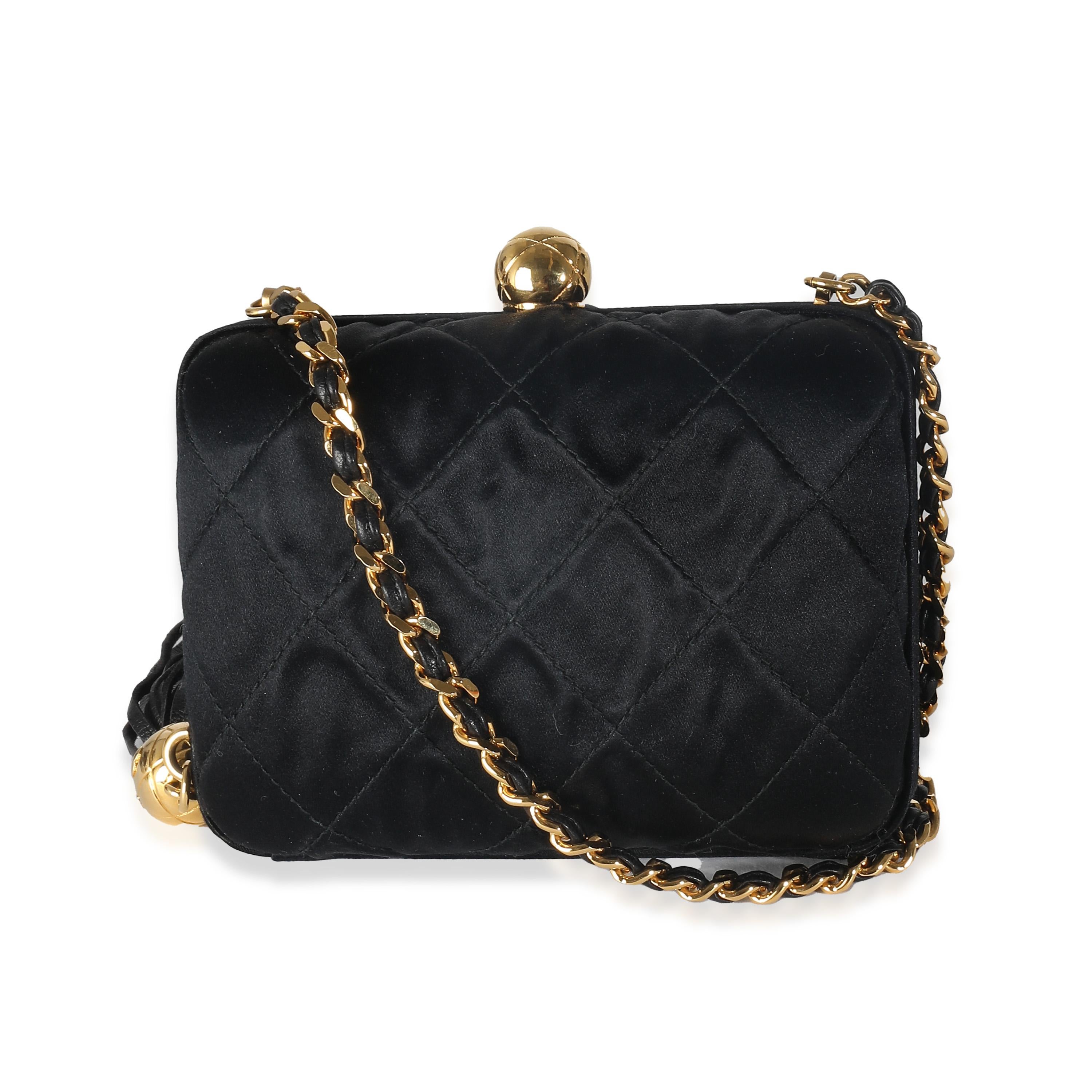 Listing Title: Chanel Black Quilted Satin CC Tassel Box Clutch
SKU: 138211
Condition: Pre-owned 
Handbag Condition: Good
Condition Comments: Item is in good condition with apparent signs of wear. Misaligned along back base corner. Mild pilling along