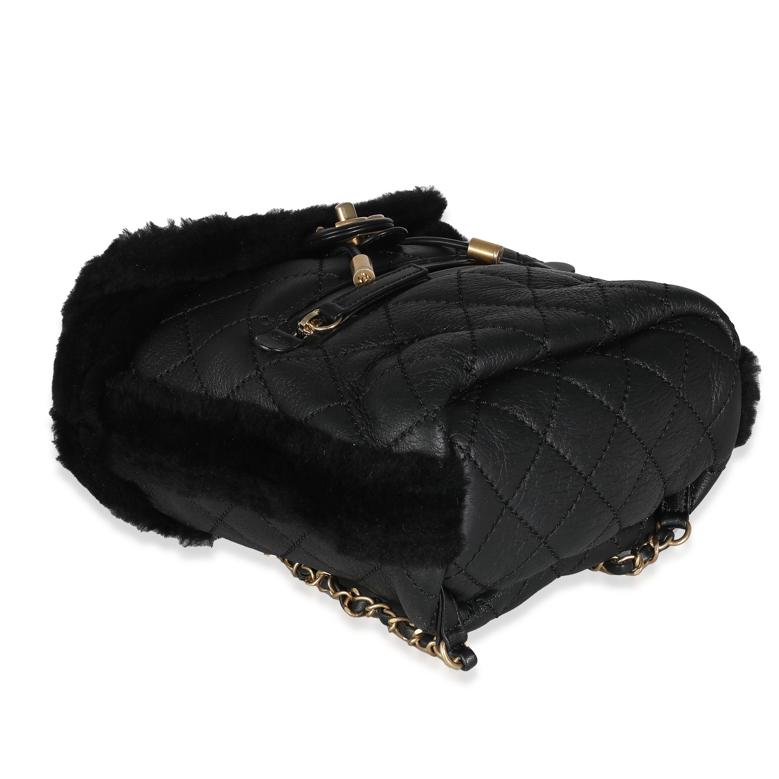 Listing Title: Chanel Black Quilted Shearling Paris Hamburg Small Backpack
SKU: 139433
Condition: Pre-owned 
Handbag Condition: Excellent
Condition Comments: Item is in excellent condition and displays light signs of wear.  Light scuffing along