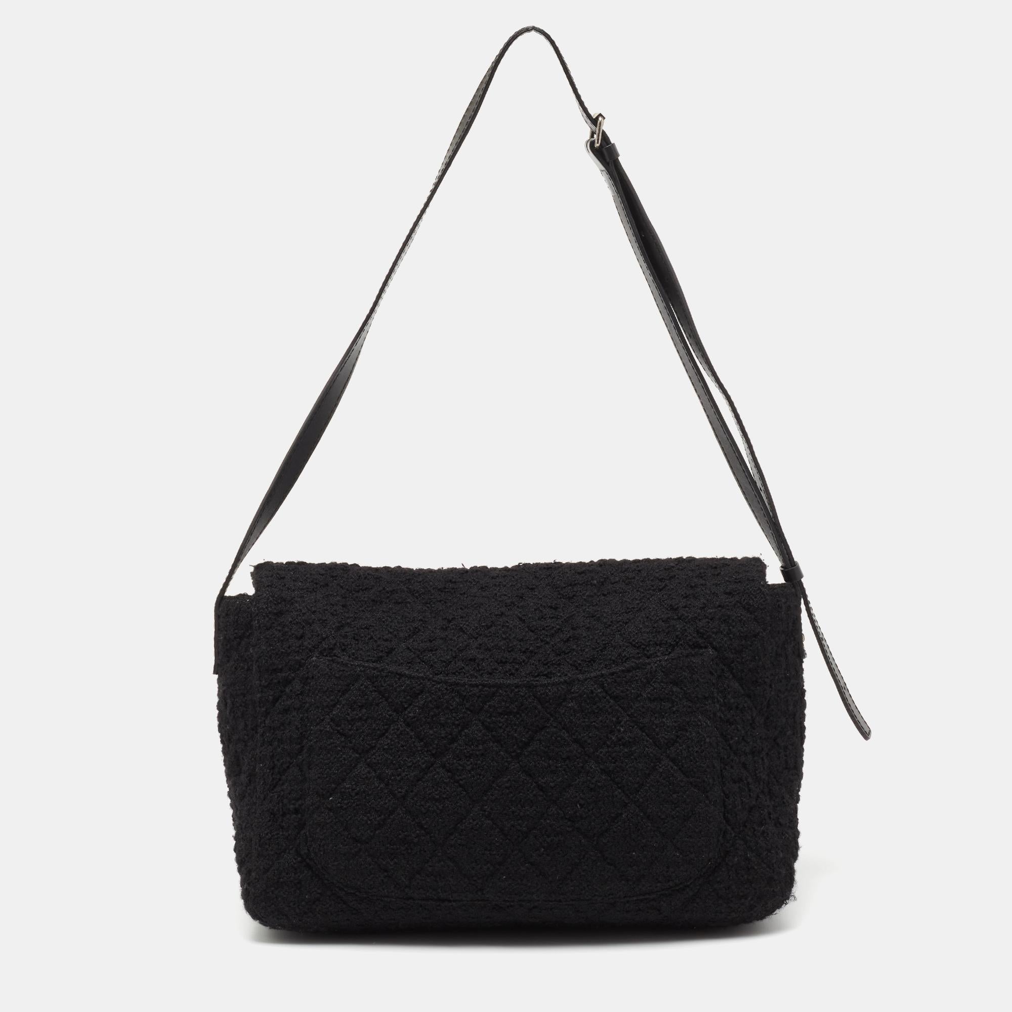 Introduce Chanel's irreplaceable style to your closet with this Reissue 2.55 XL Flap bag. Crafted using black tweed, the bag has a signature quilted exterior, the Mademoiselle lock on the front, and a canvas-lined interior. Complete with a shoulder