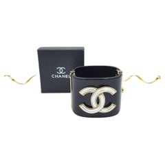 Chanel Fall 2024 Black Resin CC Logo Cuff Bracelet with Gold & White