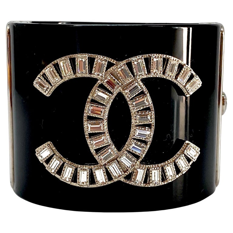 Chanel Black Resin with Rhinestone Logo Cuff, Spring 2009 Collection at  1stDibs | chanel resin cuff, chanel cuff, chanel double c ring