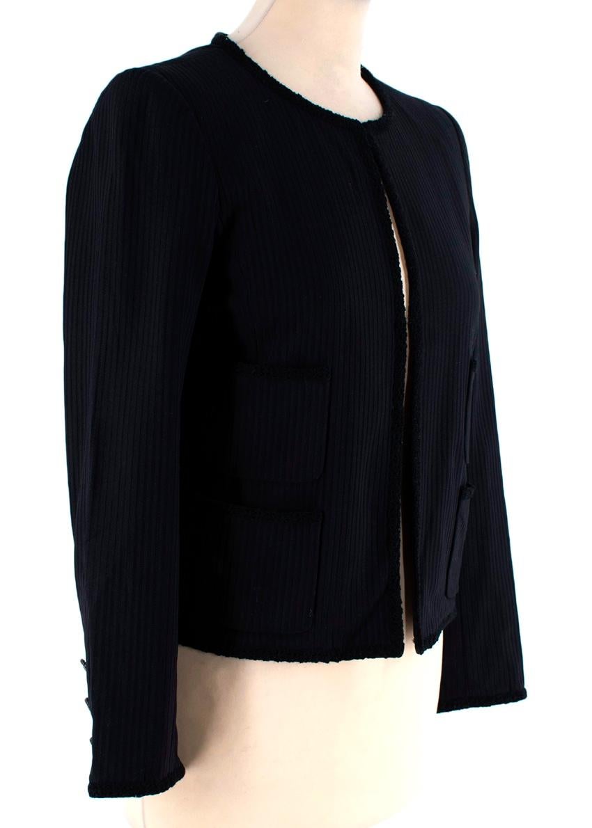 Chanel Black Ribbed Collarless Jacket
 

 - Contemporary take on the classic Chanel jacket
 - Crafted from lightweight stretch jersey with a linear rib
 - Edged with chenille piping
 - Hook & eye closure at the neck, with an open waistline
 - 4