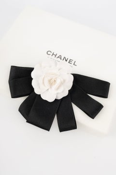 Chanel Black Ribbon Brooch with a White Camellia