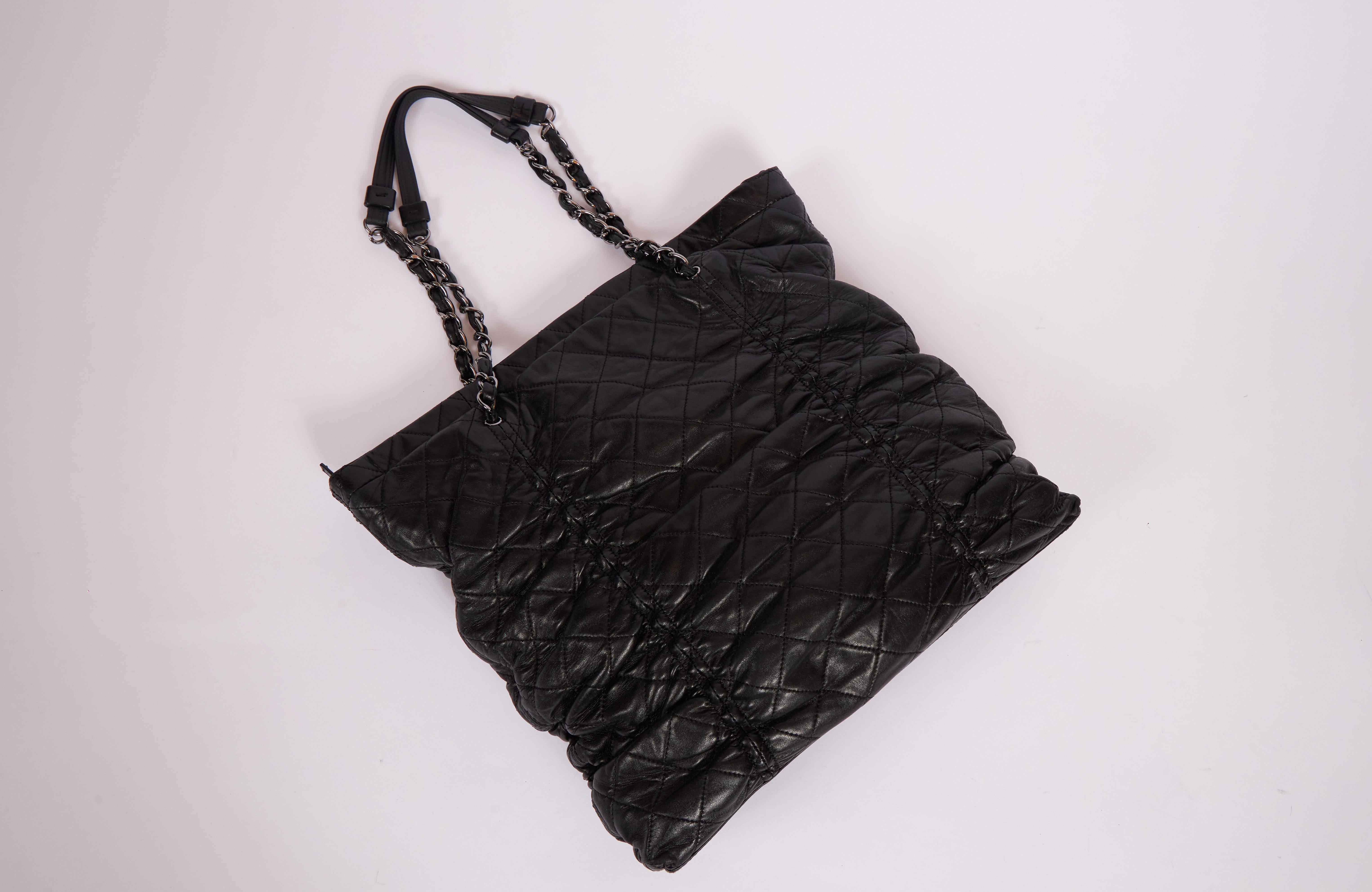 Chanel butter lambskin touched black shoulder tote. Top zipper. Hologram and generic dust cover. Shoulder drop 9