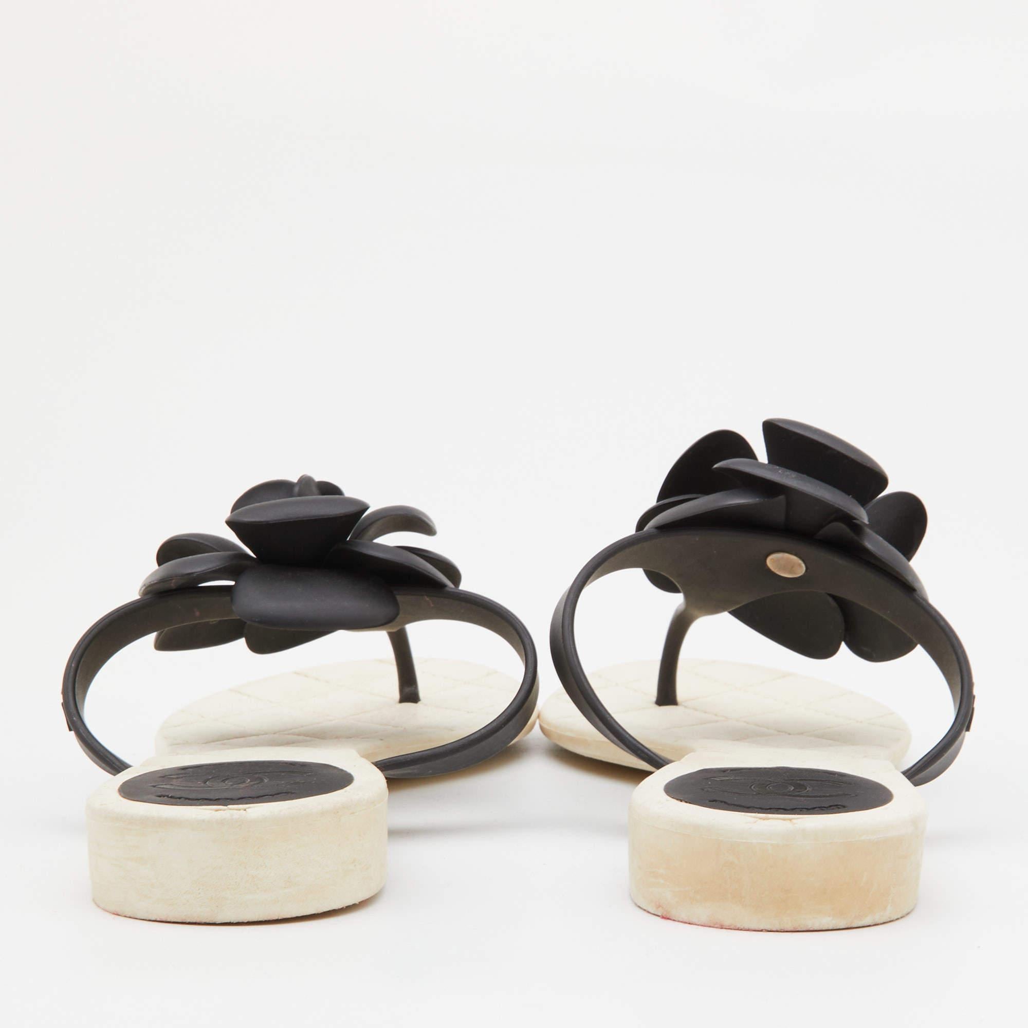 This summer, give an edge to your outfit by stepping out in these thong sandals from the house of Chanel. Crafted from rubber, they feature a CC-adorned Camellia flower on the front.

