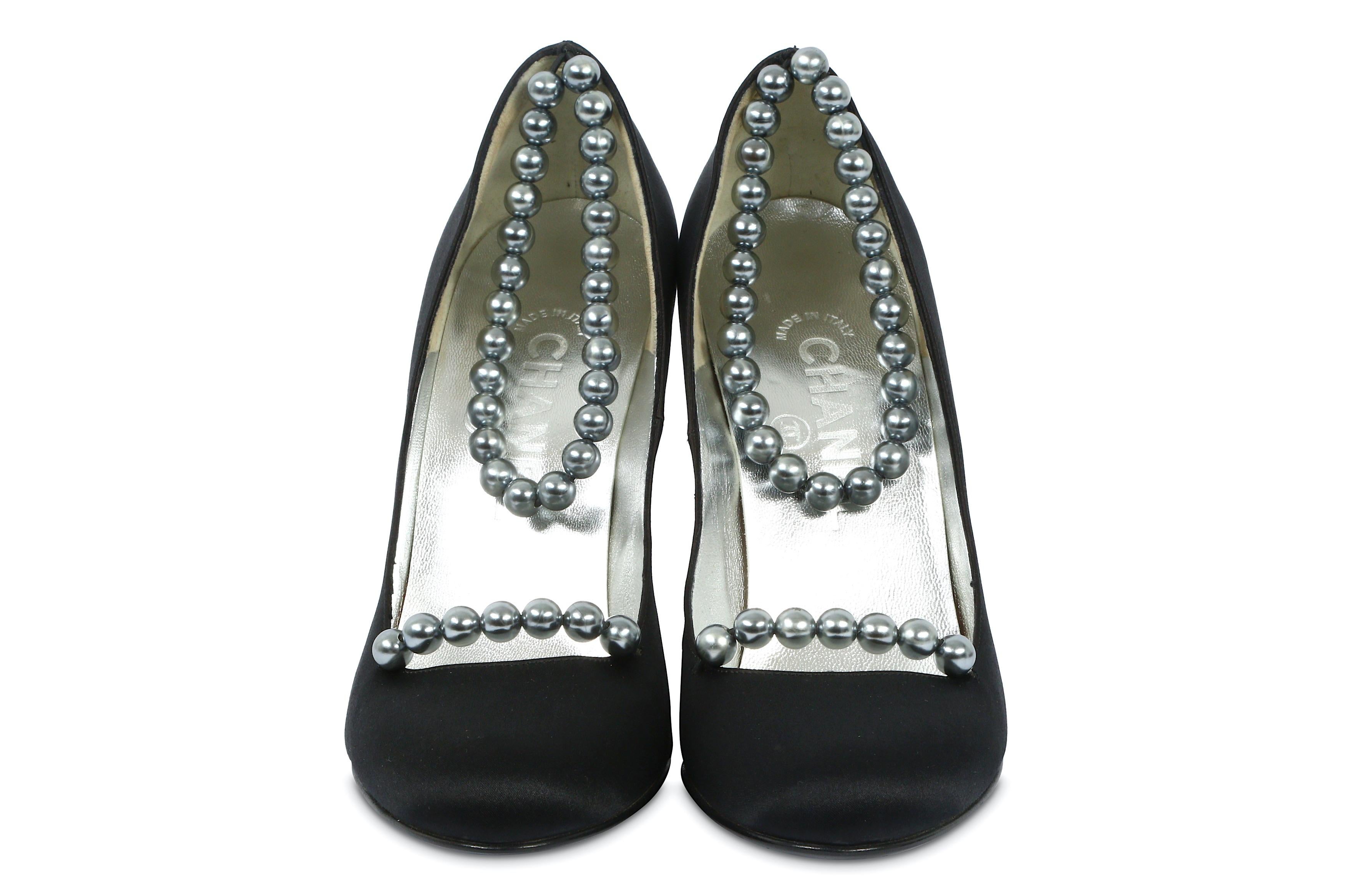 Vintage Chanel black satin pumps with faux silver pearl detail at the ankle and the bridge. Size 37 1/2. In excellent condition - never been worn.