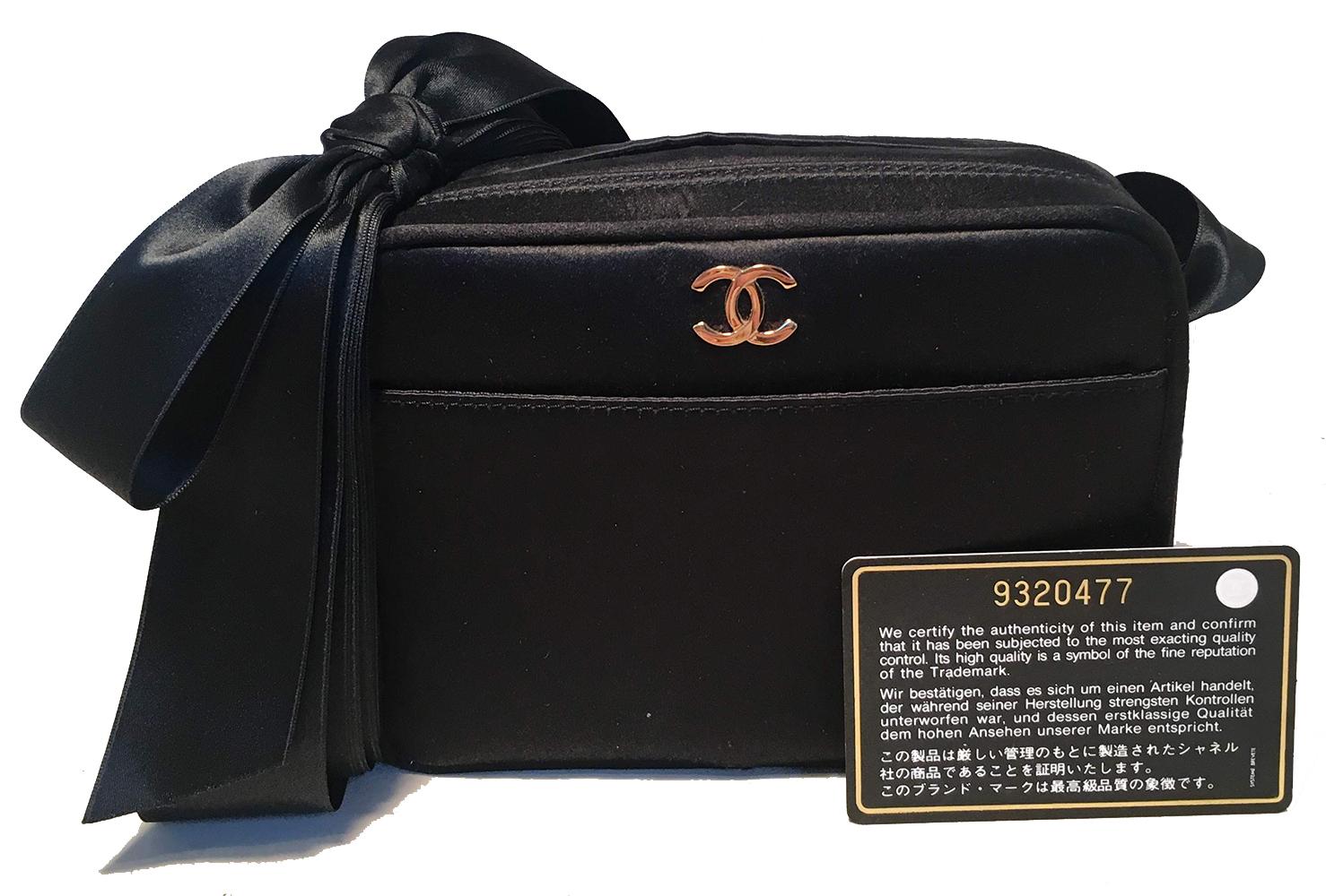 GORGEOUS Chanel black satin ribbon evening bag in excellent condition. Black satin exterior with a front slit pocket and small gold CC logo. Multiple black satin ribbon shoulder strap can be worn a variety of ways to suit your personal style. Tie a