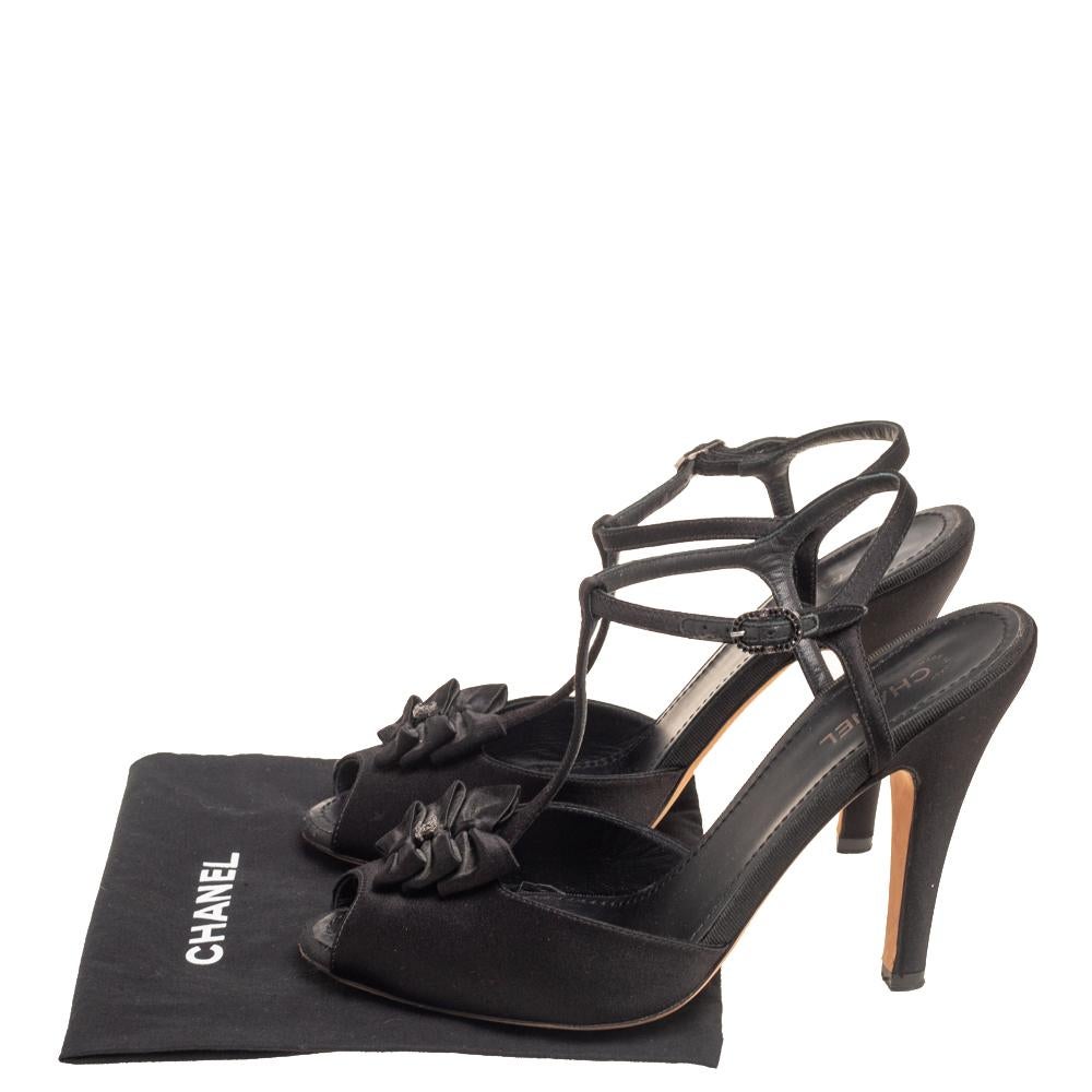 Exuding beauty in true luxury style are these sandals from the house of Chanel! They've been crafted from satin and designed with buckle ankle straps, 12 cm heels, and bows on the uppers. You can flaunt them with numerous outfits.

Includes: