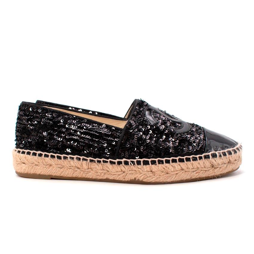  Chanel Black Sequin & Patent Toe Cap Espadrilles
 

 - Classic espadrielle shape given a Chanel overhaul, featuring a glamourous black sequin upper, contrasted with a patent toe cap, and CC applique
 - Blanket stitched raffia toe and midsole
 -