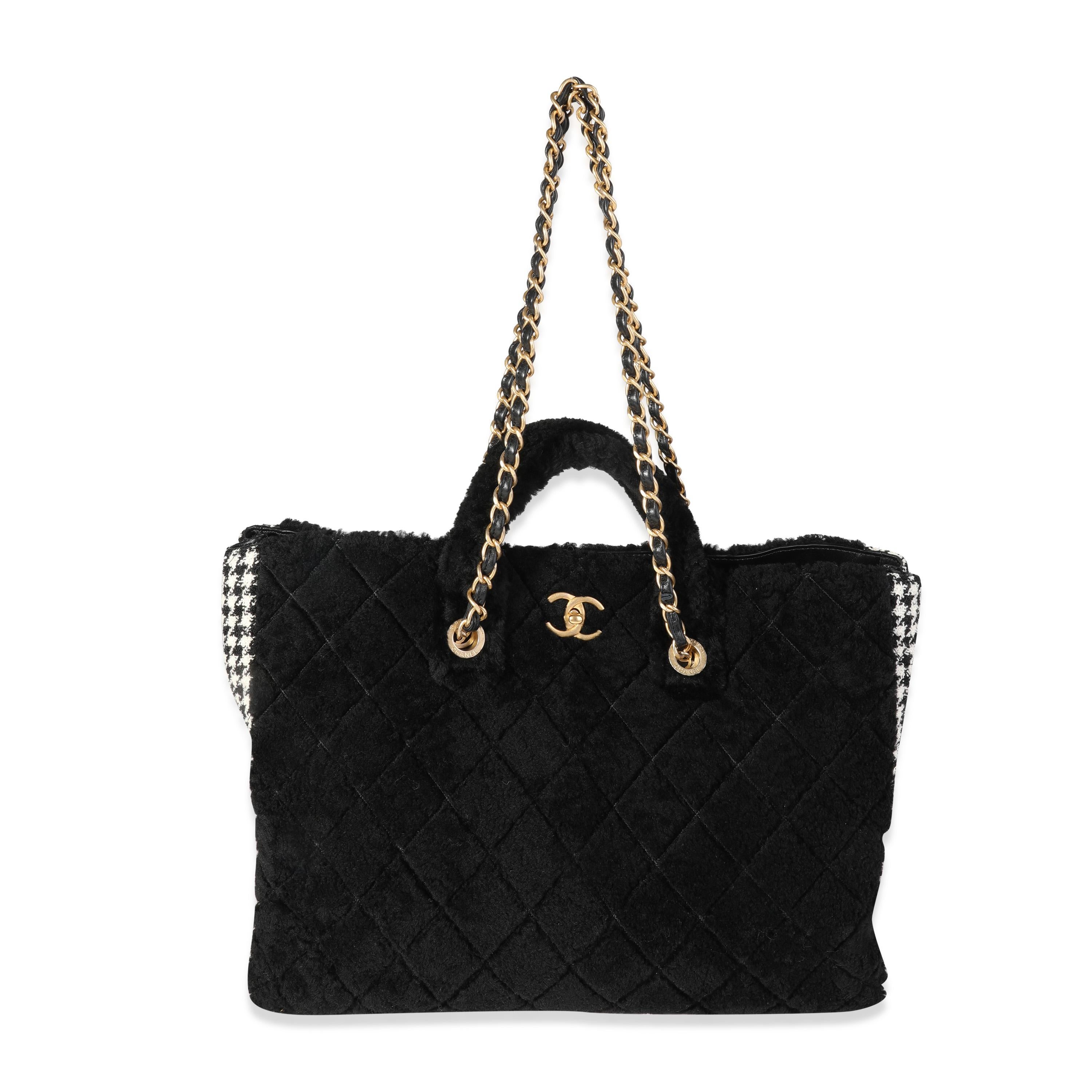 Listing Title: Chanel Black Shearling & Houndstooth Boucle Shopper Tote
SKU: 119900
Condition: Pre-owned (3000)
Handbag Condition: Never Worn
Brand: Chanel
Model: Black Shearling Tweed Shopper Tote
Origin Country: France
Handbag Silhouette: