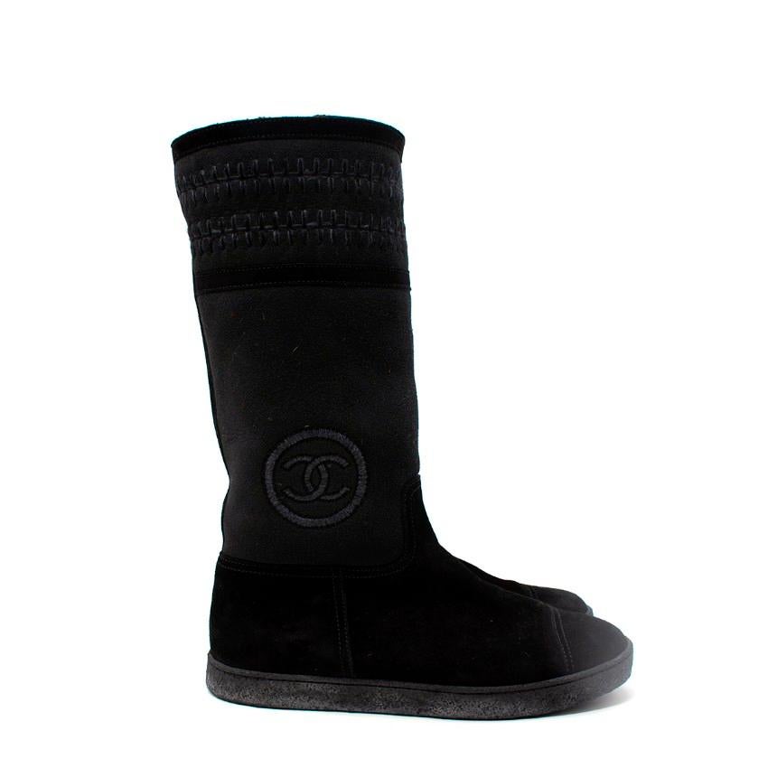  Chanel Black Sheepskin & Suede Embroidered Knee Boots
 

 - Sheepskin winter boot with tonal suede toe-cap and upper
 - Tone-on-tone blanket stitch decoration to cuff, and CC logo embroidered on outer side
 - Suede banding on cuff
 - Thick rubber