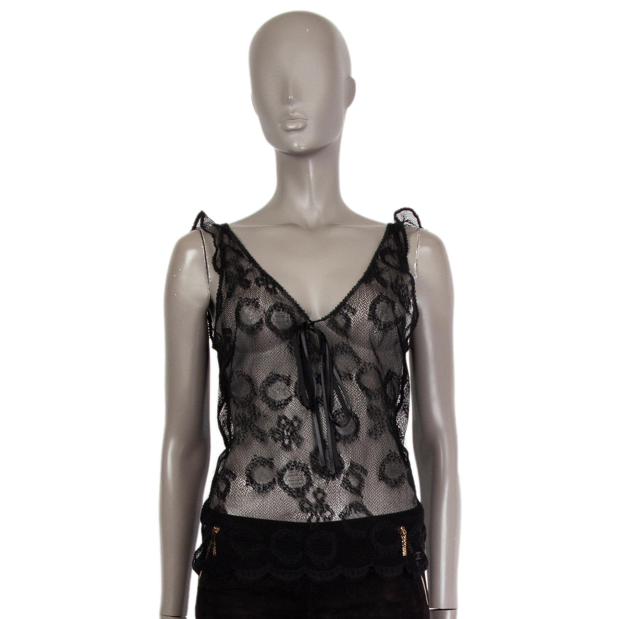 Chanel sheer lace tank-top in black viscose blend (assumed as tag is missing) with a v-neck. Unlined. Has been worn and is in excellent condition.  

Tag Size Missing Size
Size M
Shoulder Width 37cm (14.4in)
Bust 82cm (32in) to 84cm (32.8in)
Waist
