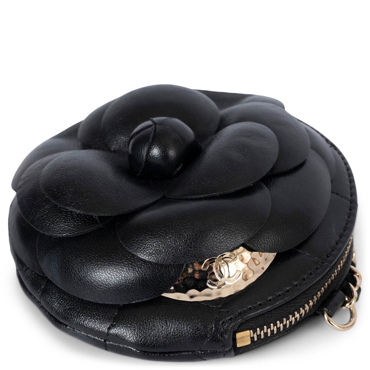100% authentic Chanel Camellia round clutch with chain in black shiny calfskin leather. Features gold-tone hardware, a chain strap and CC button on the front. Opens with a zipper with CC chain pull and is lined in grosgrain fabric. This stunning