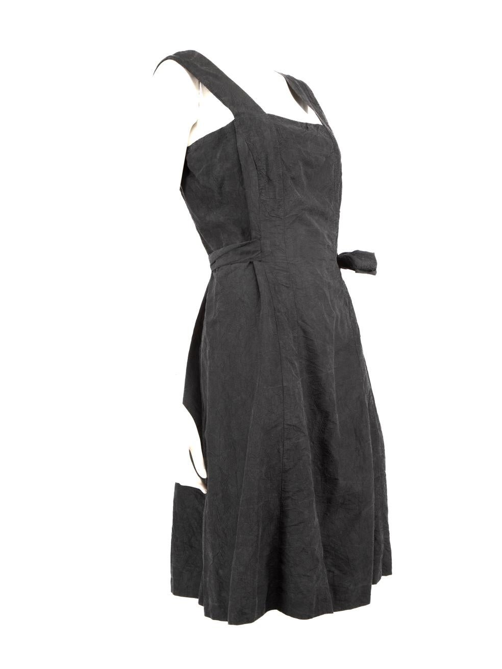CONDITION is Good. Minor wear to the dress is evident, there is discolouration around the internal and external underarm on this used Chanel designer resale item.
 
 Details
 Black
 Synthetic
 Dress
 Knee length
 Sleeveless
 Square neckline
 Back