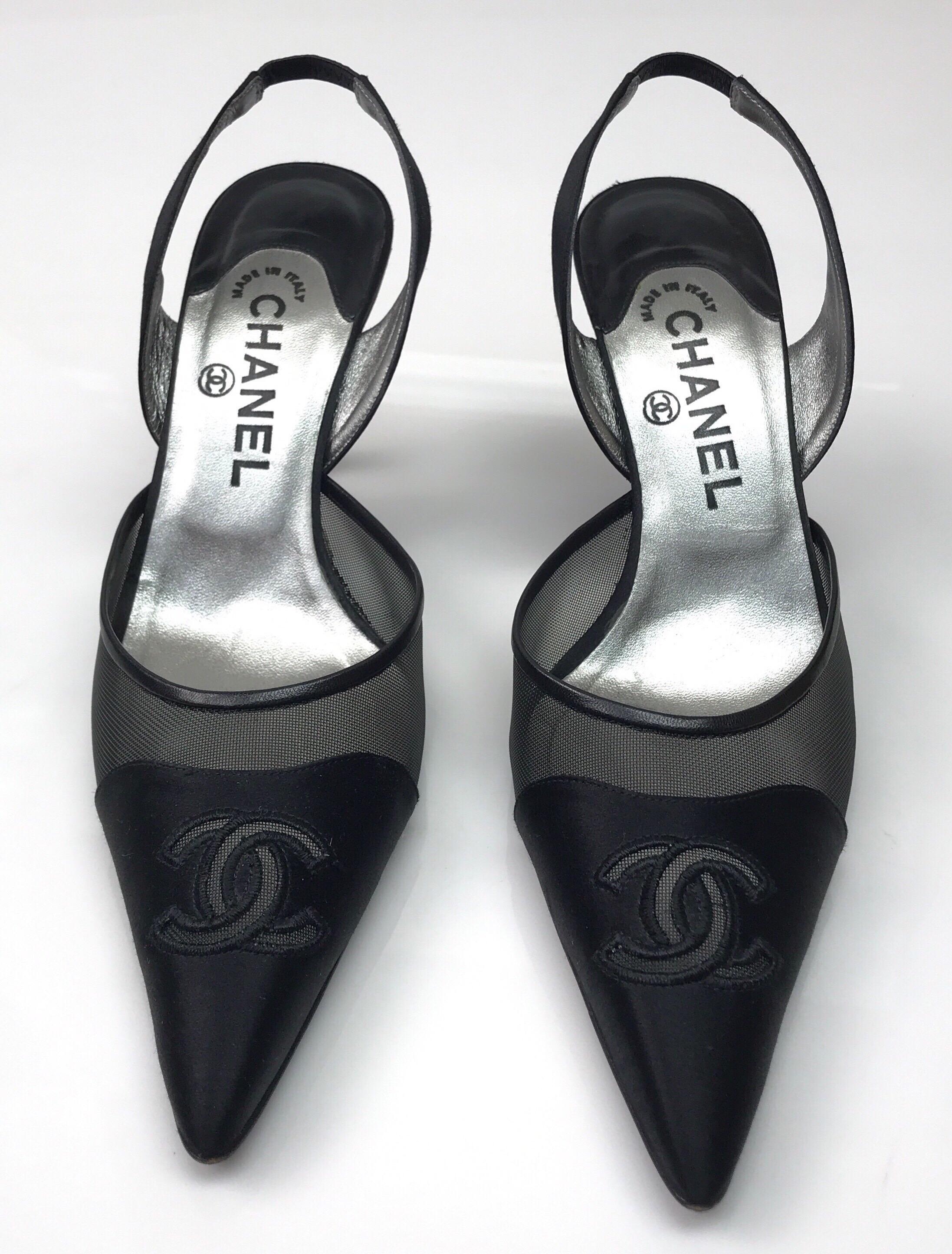 CHANEL Black Silk and Mesh Slingback w/ front CC-38.5. These beautiful Chanel heels are in excellent condition. They show barely any sign of use, with exception to the bottom of the shoe showing some wear. They are a long pointed toe and made of