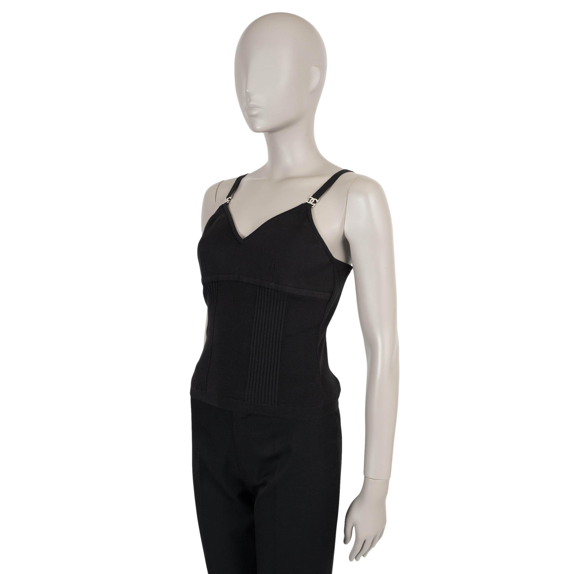 This 100% authentic Chanel v-neck tank top in black stretchy silk (53%), cotton (43%) and polyamide (4%) offers a flattering, form-fitting silhouette. Embellished with CC crystal logos on the shoulder straps, this top adds a touch of luxury and