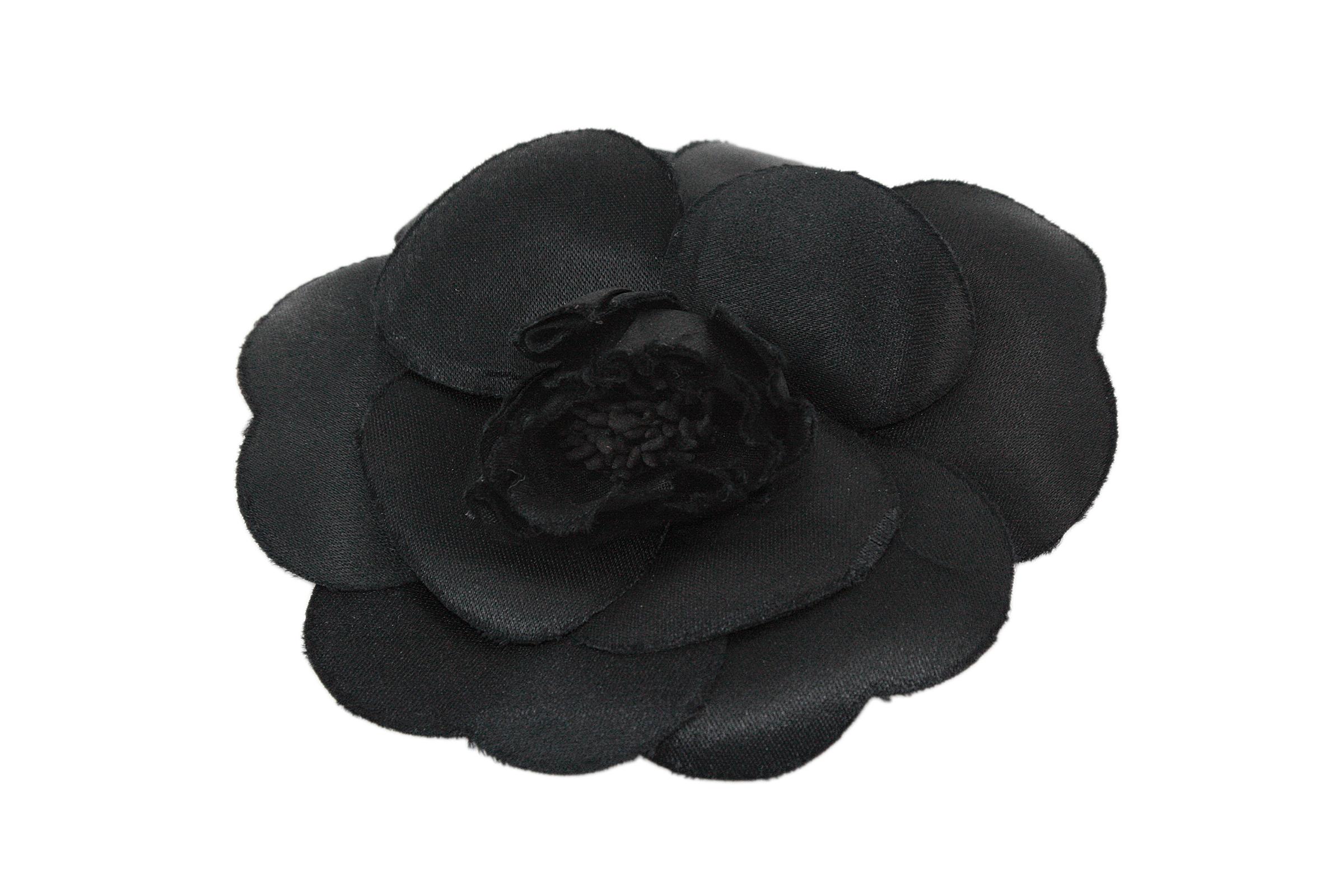 Chanel camellia brooch
Black silk fabric 
Silver needle clasp closure
Made in France 
