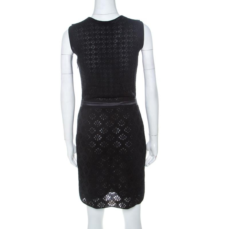 Add this exquisite Chanel dress to your wardrobe today and wear it on when you have formal events to attend. It has a crochet lace overlay and a band at the waist that helps refine the shape of the dress. The black creation is complete with a