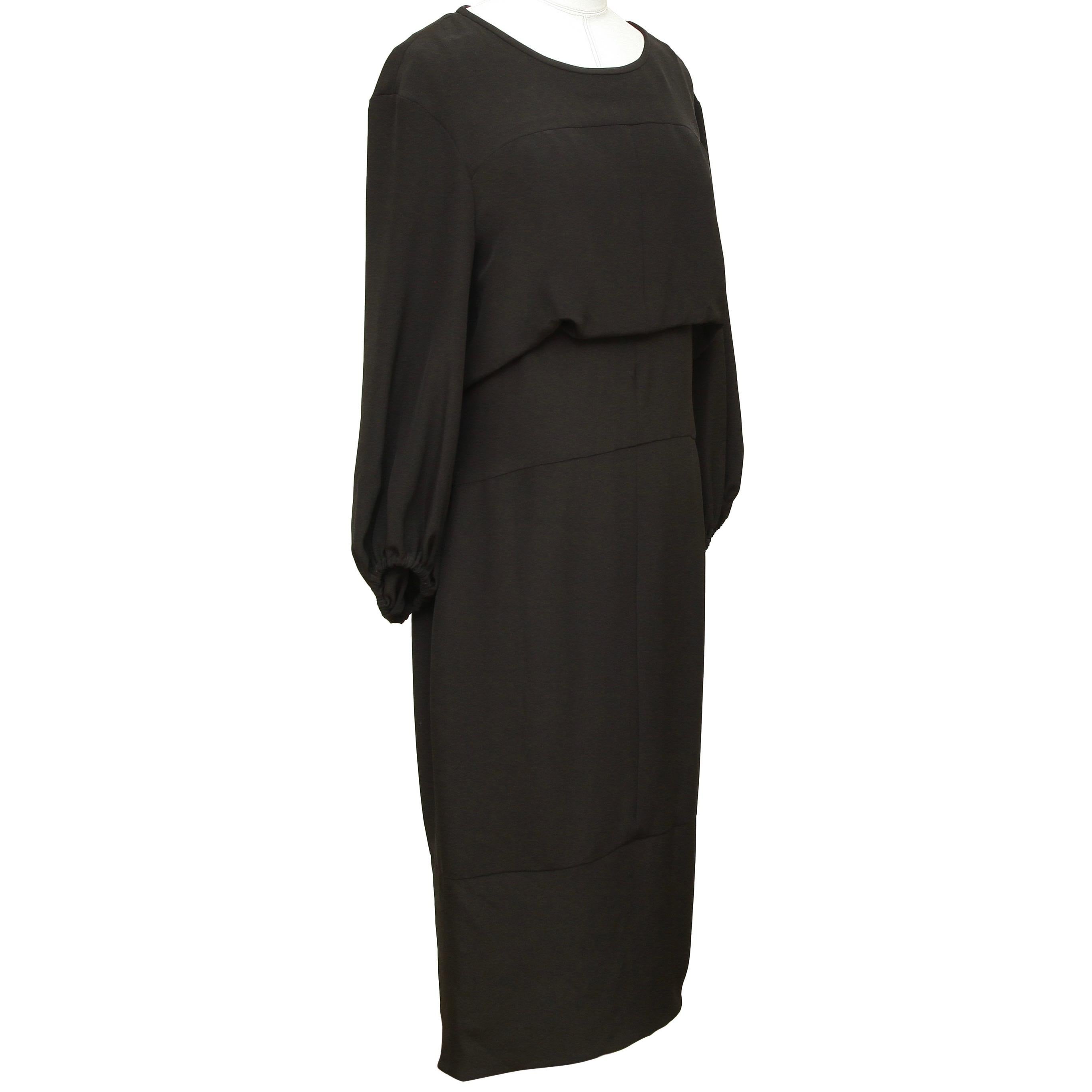 GUARANTEED AUTHENTIC CHANEL 2012 BLACK SILK 3/4 SLEEVE DRESS

Design:
- Black silk shift dress.
- 3/4 Sleeve.
- Elastic at arms.
- Bateau neck.
- Fully lined.
- Comes with extra fabric swatch.

Material: 100% Silk; 100% Silk Lining

Size: