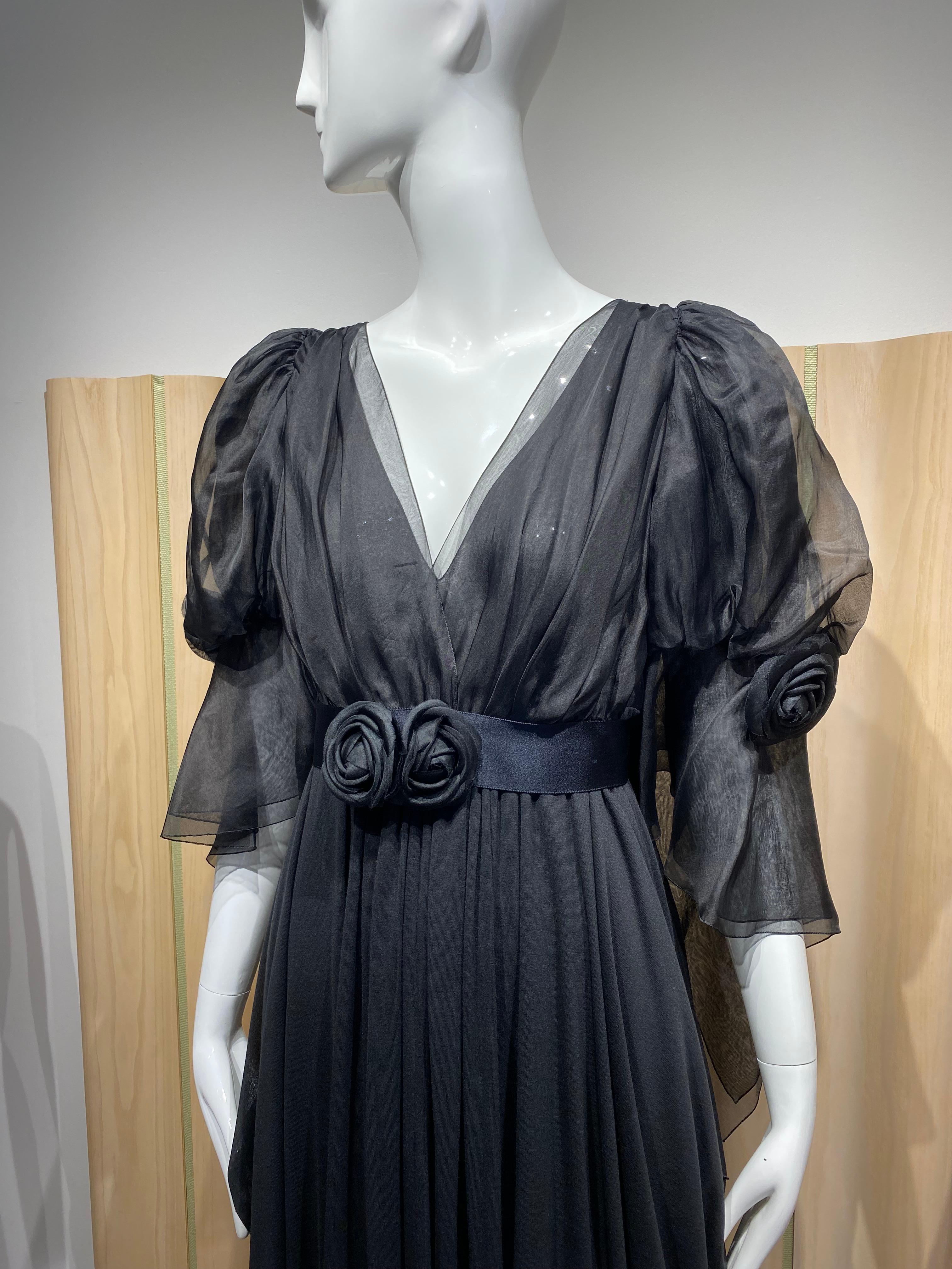2009 Chanel Silk  Gown with dramatic puffy sleeves and beautiful draping. 
Fabric : Silk organza and silk jersey.
V neck
Empire waist 

Marked size 42F, fit us 4/6/8
Measurement:
Bust : 36”
Waist 28” stretch to 30”
Length : 59”