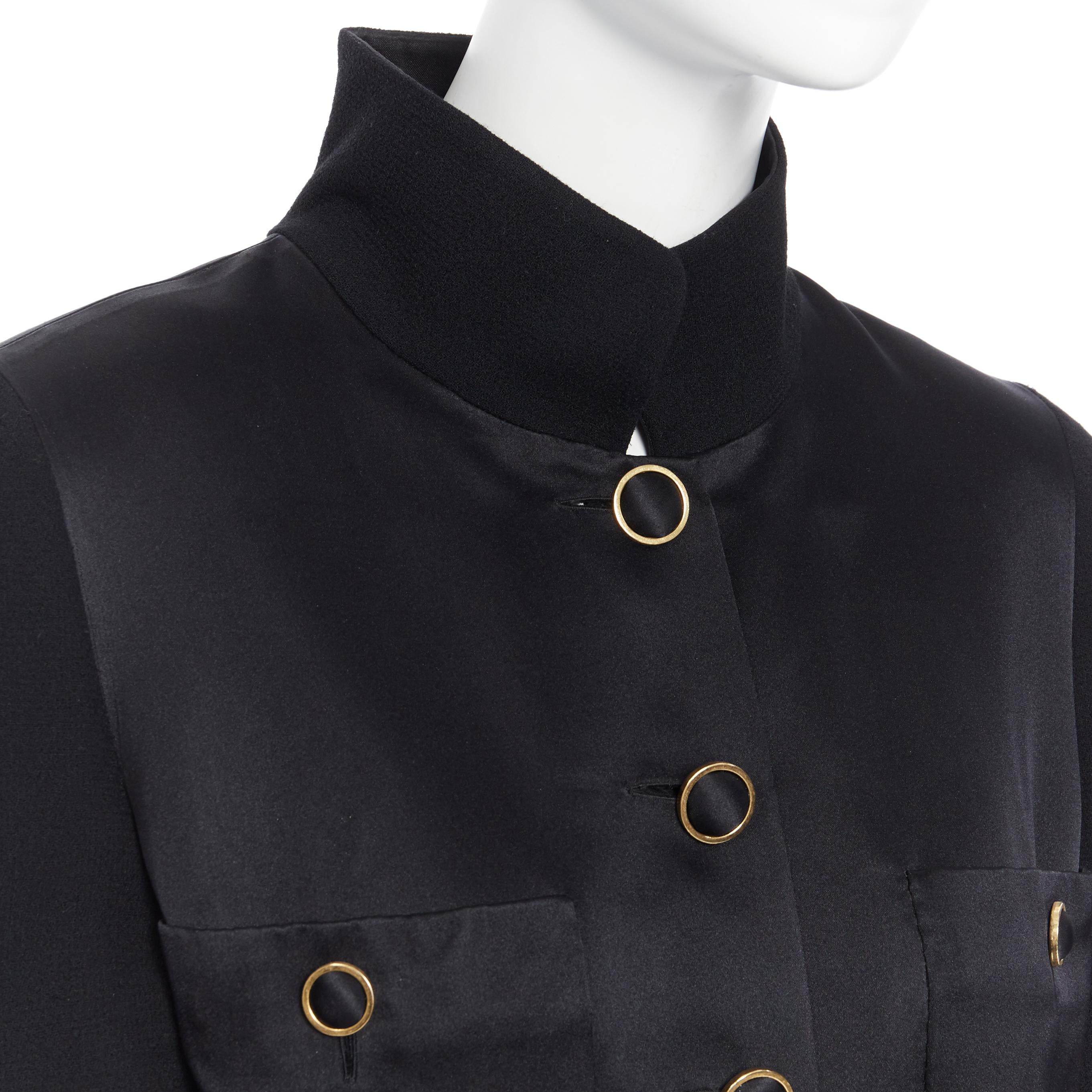 CHANEL black silk satin crepe 4 pockets gold high collar mandarin jacket FR42
Brand: Chanel
Designer: Karl Lagerfeld
Color: Black
Pattern: Solid
Closure: Button
Extra Detail: Classic mandarin jacket. 4 front patch pockets. Constructed with a silk