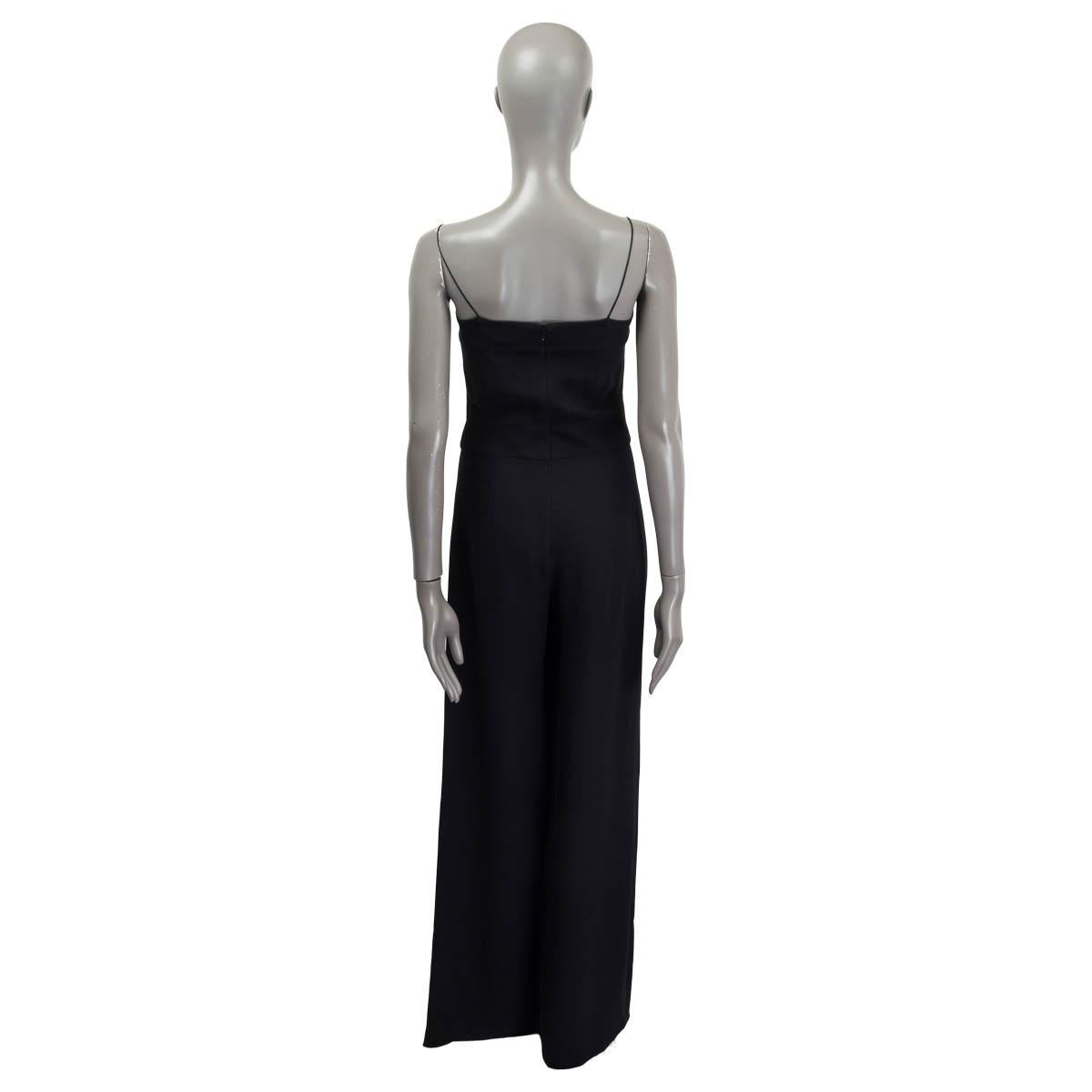 100% authentic Chanel sleeveless jumpsuit in black silk (100%). Features breast pads and opens with a concealed zipper and a hook on the back. Unlined. The zipper is broken but it is still working otherwise in excellent condition. 

Measurements
Tag