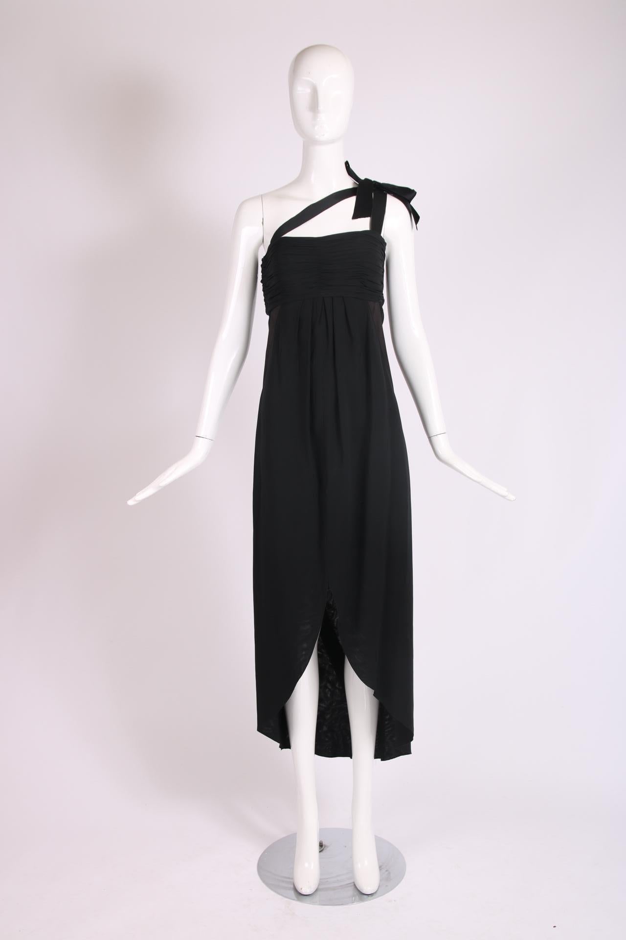 Vintage Chanel black silk strapless gown with satin bow at shoulder, ruching at the bust, a single shoulder constructed from black satin ribbon which also serves as a design motif at the skirt front and back. Labeled, 