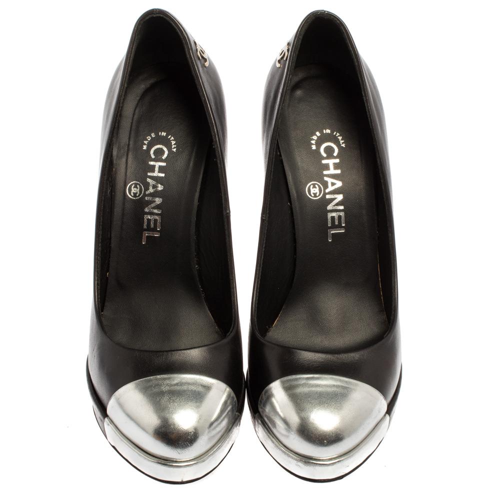 Classy and very stylish, these black pumps from Chanel are a worthy investment! They are crafted from leather and feature silver cap toes, platforms, comfortable leather-lined insoles, the iconic CC logo detailing on the counters, and 13 cm heels.