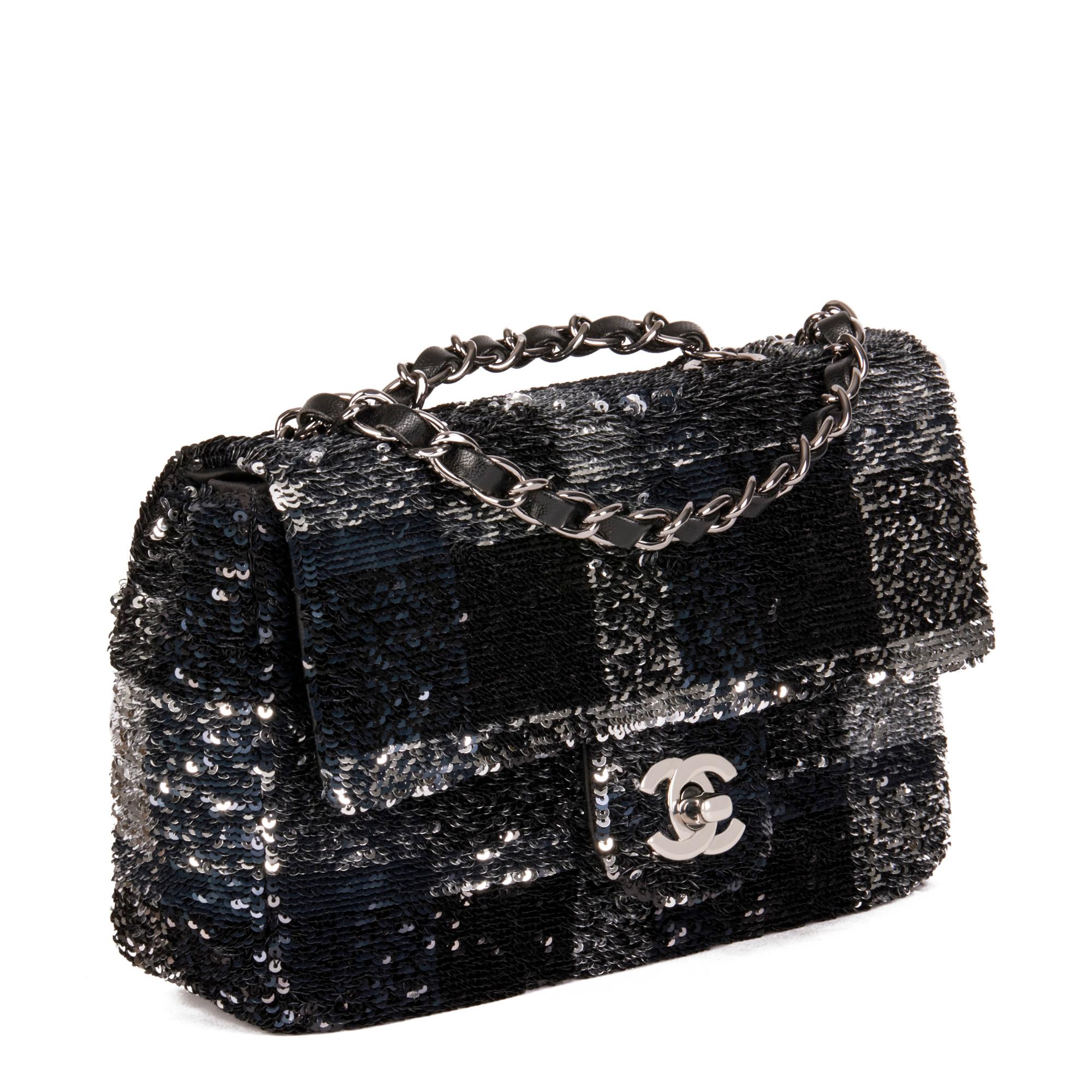 CHANEL
Black & Silver Sequin Rectangular Mini Flap Bag

Xupes Reference: CB563
Serial Number: 27533883
Age (Circa): 2019
Authenticity Details: Serial Sticker (Made in Italy)
Gender: Ladies
Type: Shoulder

Colour: Black, Silver
Hardware:
