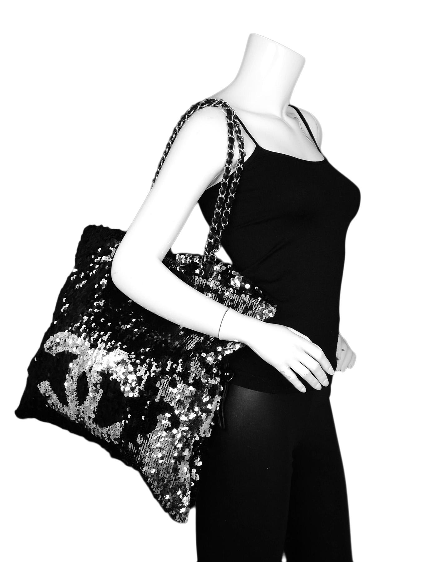 Chanel Black/Silver Sequin Summer Night Drawstring Tote Bag

Made In: Italy
Year of Production: 2008 - 2009
Color: Black/silver
Hardware: Silvertone
Materials: Sequin, leather, metal
Lining: Black satin
Closure/Opening: Open top with magnetic