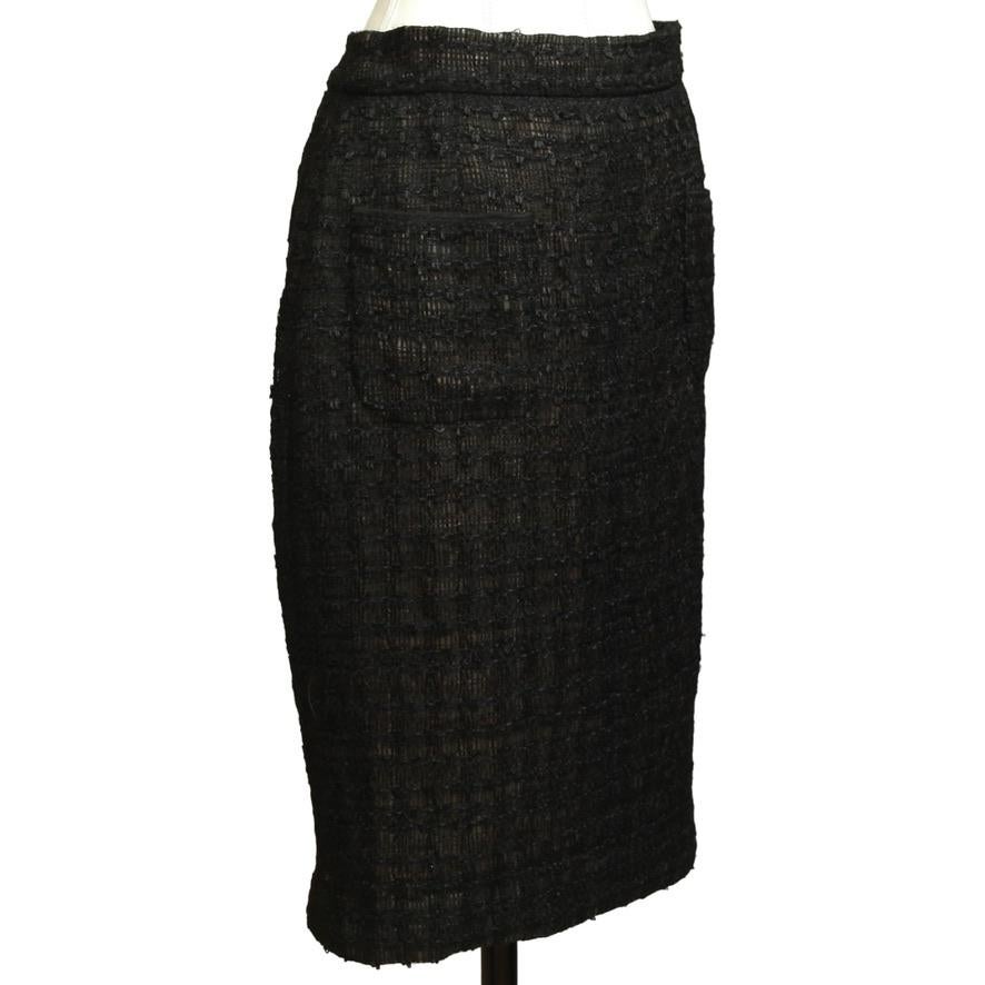 GUARANTEED AUTHENTIC CHANEL SPRING 2012 RUNWAY FANTASY TWEED BLACK SKIRT

Matching Jacket For Sale In A Separate Listing.

Details:
• Black lightweight tweed pencil straight skirt.
• Front dual pockets.
• Rear zipper and hook & eye closure.
•