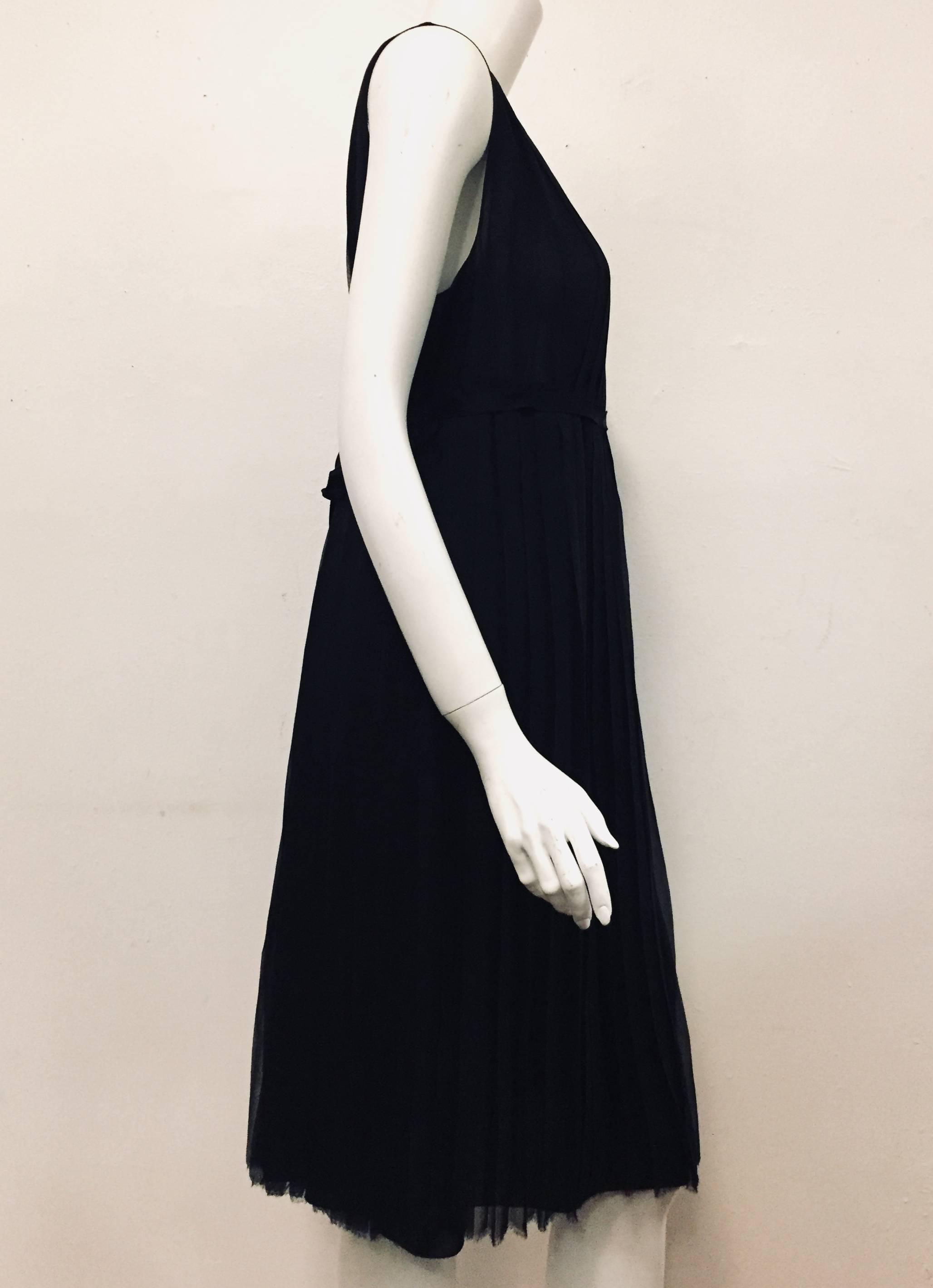 This creation pays homage to the Little Black Dress that Chanel made a “staple” for any woman in the 1920's, while bringing the concept into the now and future!  Crafted from 2 layers of ultra-luxurious 100% silk, sleeveless dress features knife