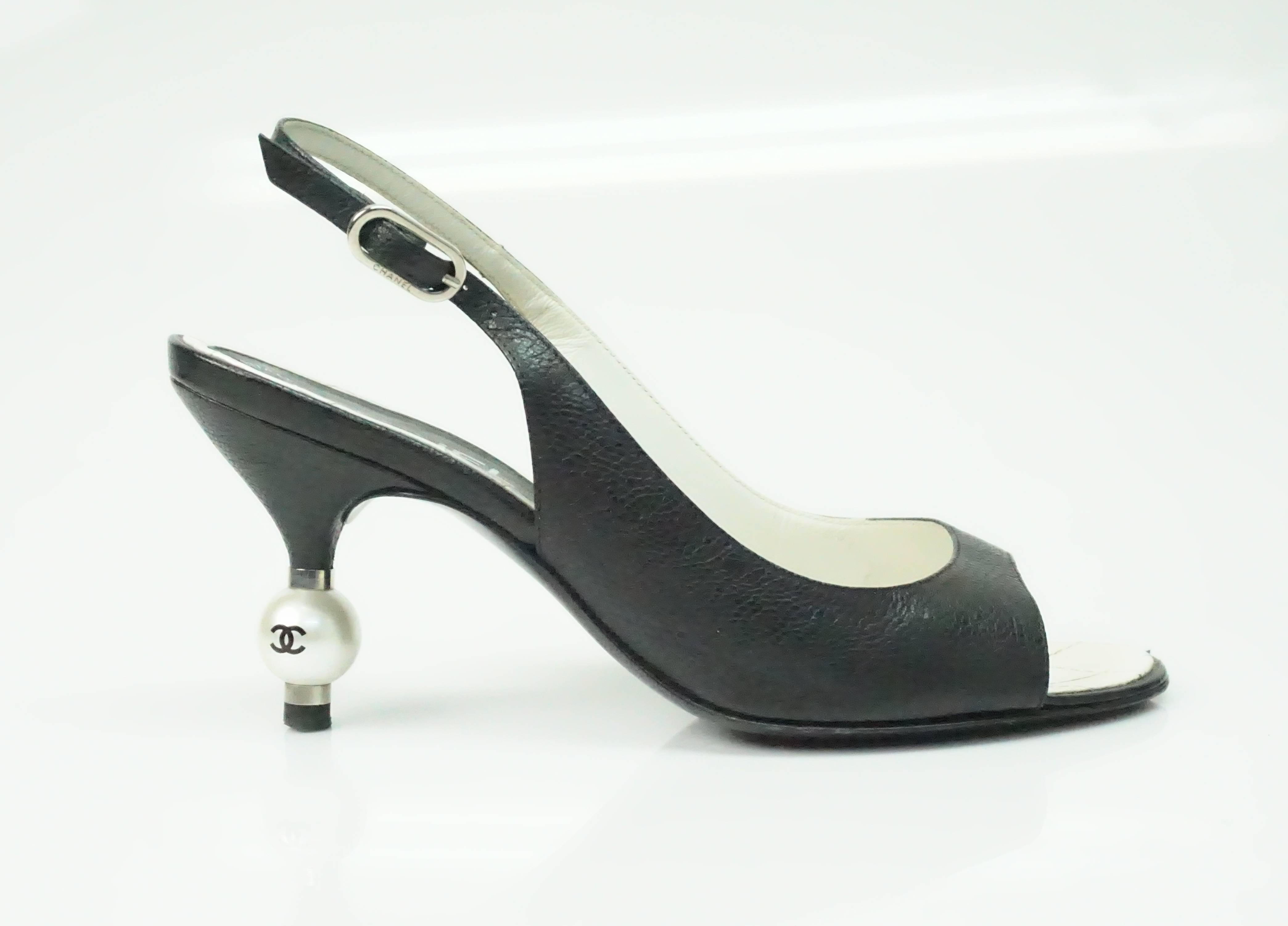 Chanel Black Slingback Heel w/ CC Pearl Heel - 36.5  This classic Chanel kitten heel is in good condition. There are some slight marks on the pearls and some minor scuffing to the front leather trim. 
The heel is 3