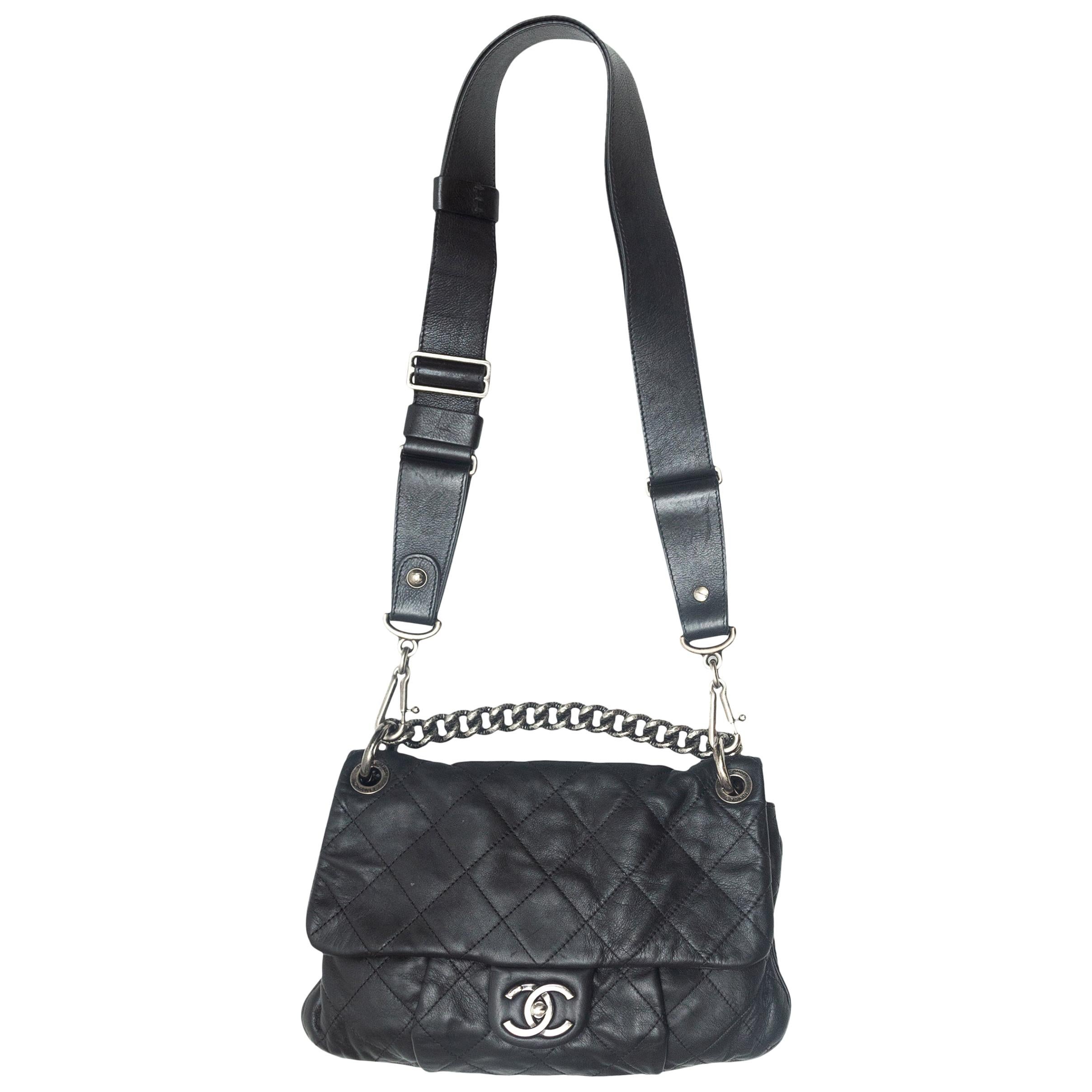 Padded Chanel Messenger bag in black with with embossed logo on the front   Labellov  Buy and Sell Authentic Luxury