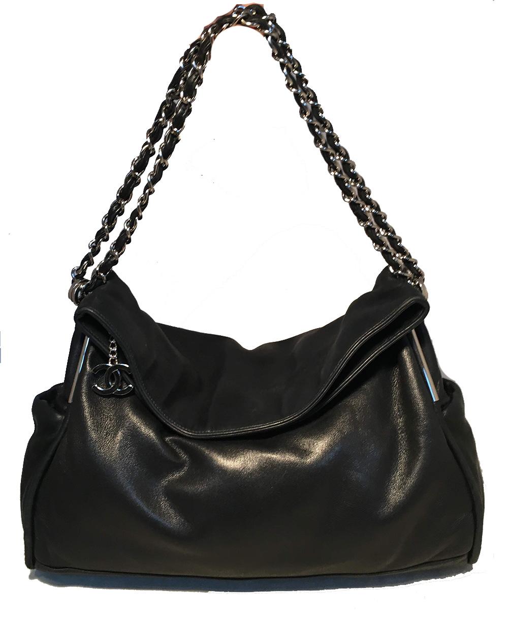 Chanel Black Soft Lambskin Leather Fold Over Shoulder Bag in excellent condition. Soft black lambskin leather trimmed with silver hardware and woven chain and leather shoulder strap. Unique fold over style top with full zip closure has a CC logo