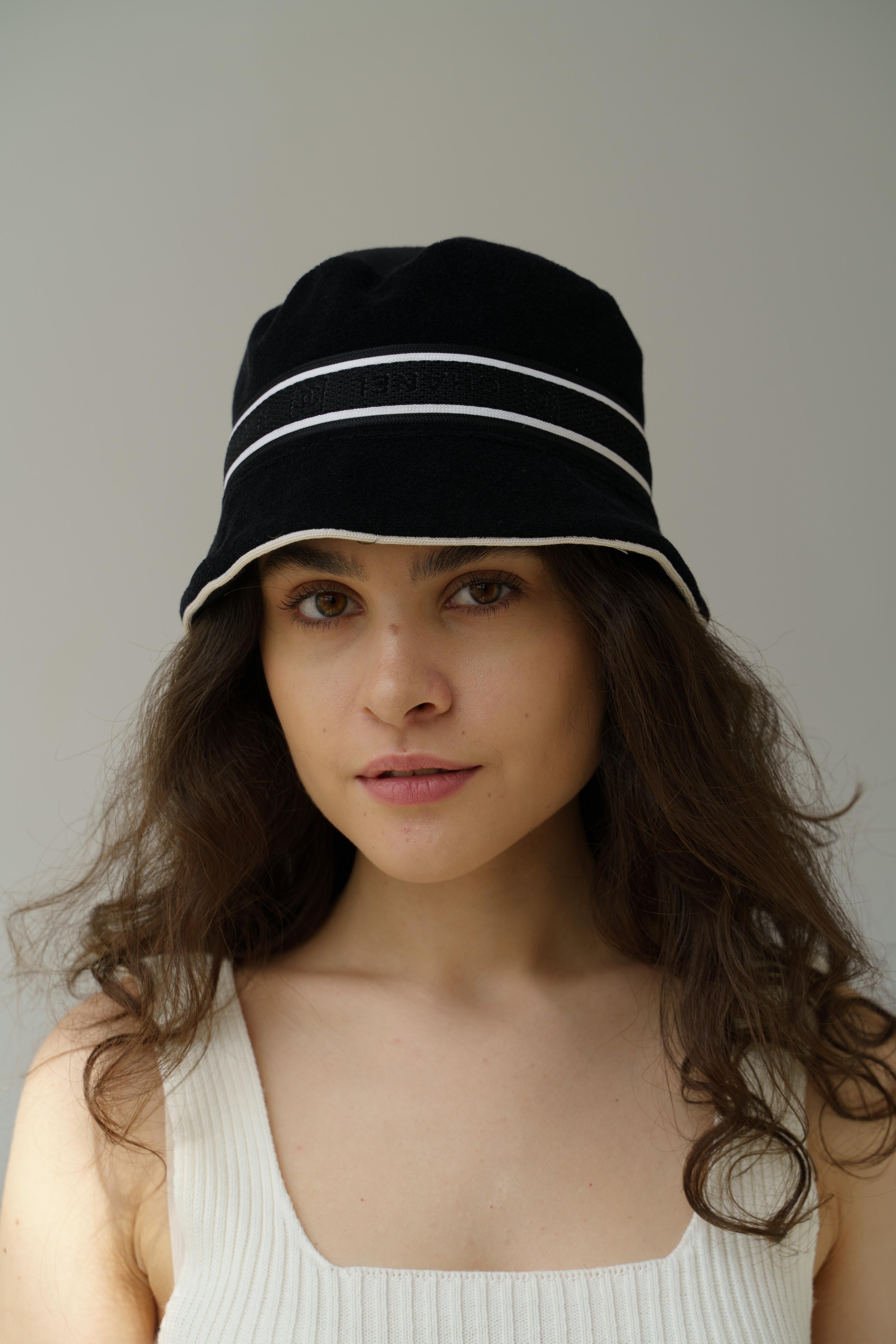 Chanel Black Sport Line CC Logo Bucket Hat Y2K
Chanel by Karl Lagerfeld
Collection: vintage sport line
Country of production: France
Marked Size: S
Composition: 65% cotton, 10% polyamide, 3% polyester, 5% elastane
The top is like velour, the inside