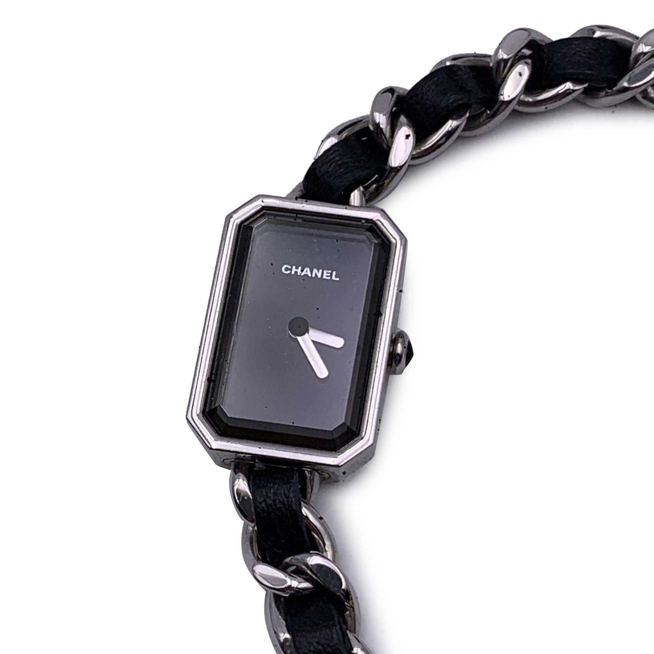 Beautiful Chanel 'Première' watch. This was the first wristwatch created by maison Chanel in 1987. The watch is made from stainless steel and it features an iconic chain-link triple row bracelet with interwoven leather. Octagonal case that recall