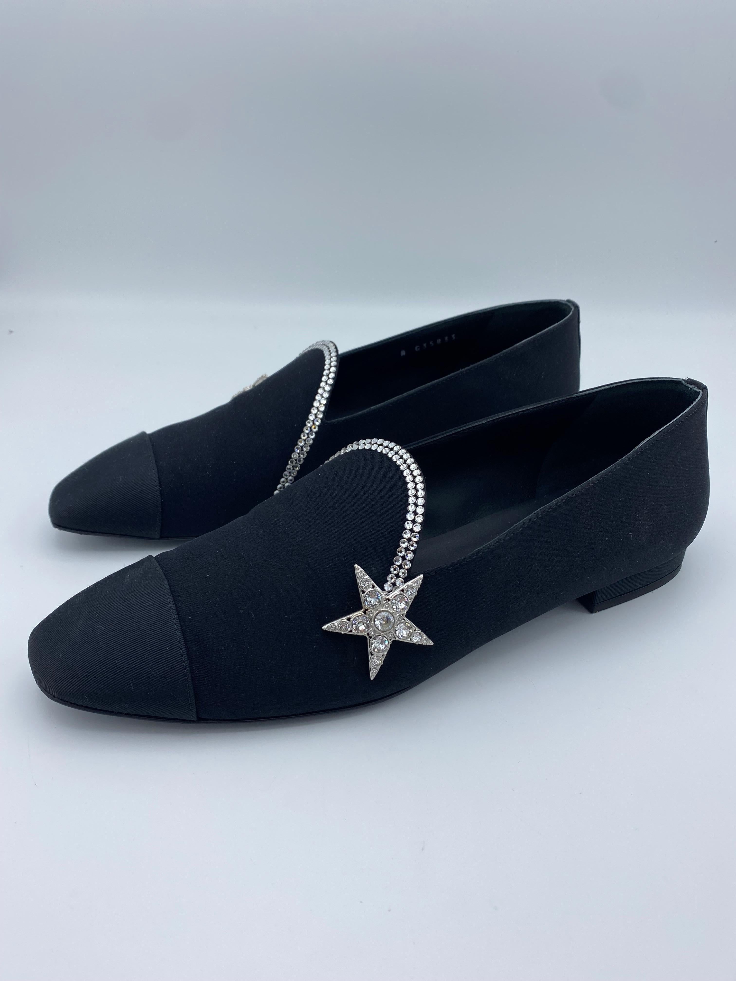 Product details:

The loafers are made out of black silk crepe and grosgrain, detailed with Swarovski crystals design. The heel height measures 0.5
