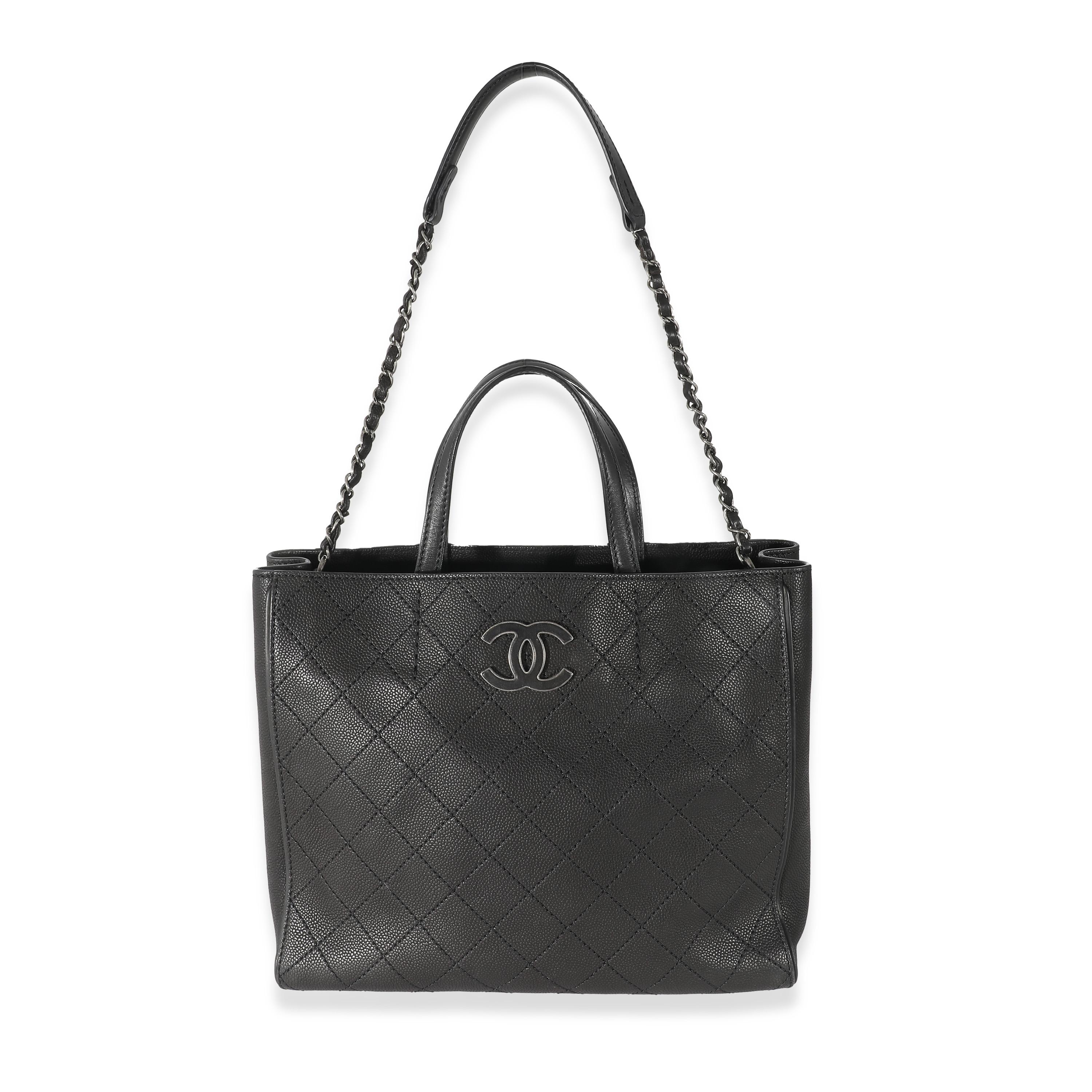 Listing Title: Chanel Black Stitched Grained Calfskin Hamptons Tote
SKU: 132944
Condition: Pre-owned 
Handbag Condition: Very Good
Condition Comments: Item is in very good condition with minor signs of wear. Light scuffing along corners, exterior,