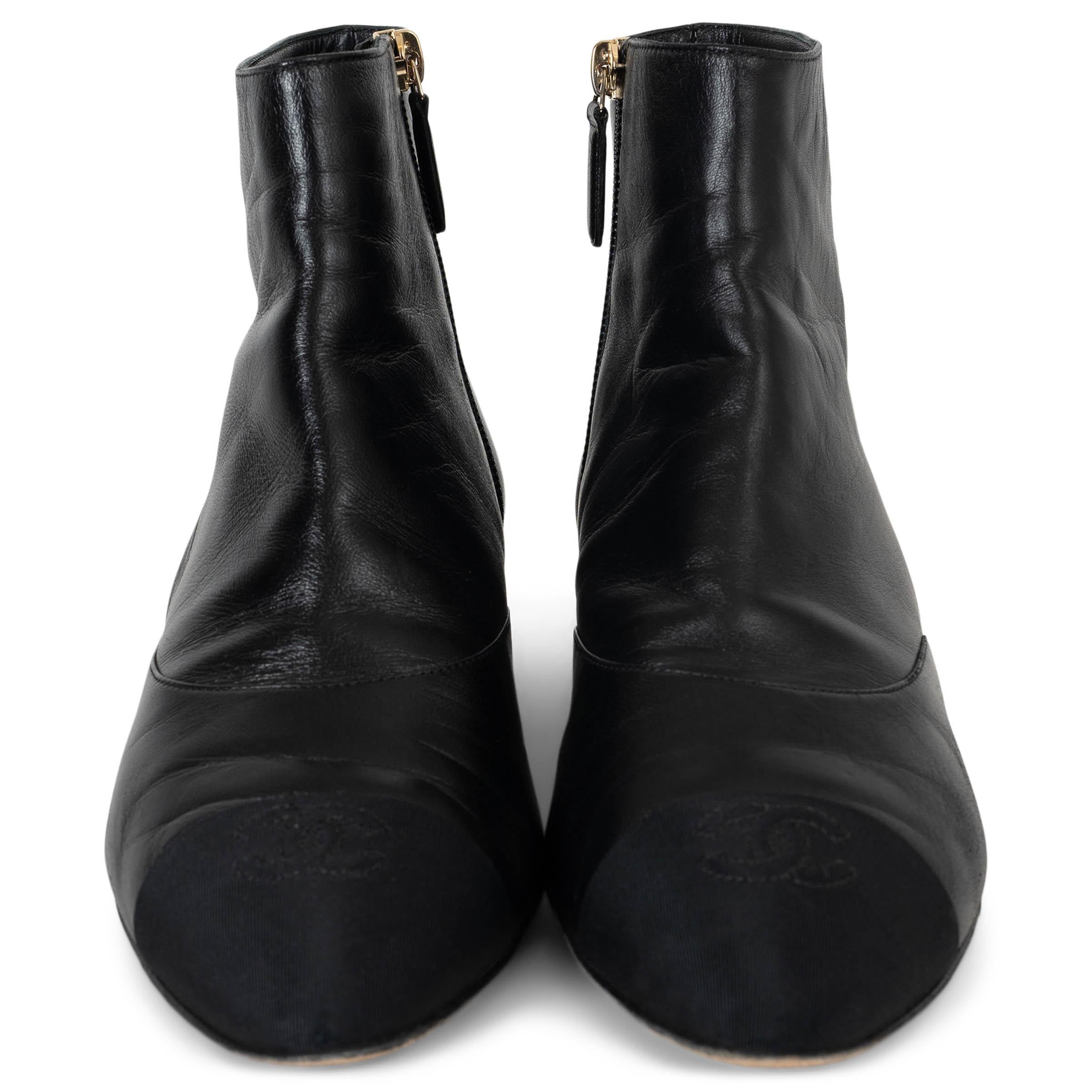 This 100% authentic Chanel flat ankle boots in black leather exude timeless sophistication with signature house details. Designed with almond toes and CC-embroidered canvas toe caps, they are elegantly finished with a pearl trim above the heels.
