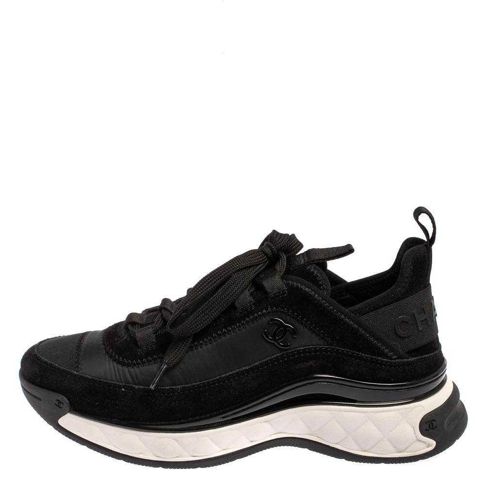 These Sport Trail low-top sneakers from Chanel offer the correct amount of style and comfort. They have been crafted from suede and nylon and designed with round toes, lace-ups on the vamps, and the iconic CC logo detailing on the sides. Comfortable