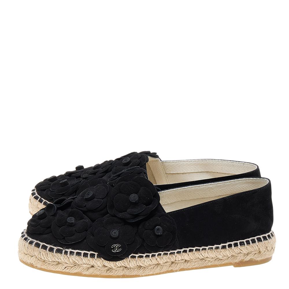From the House of Chanel, these espadrille flats are truly versatile and trendy! They are designed using black suede, with Camellia motifs embellishing their vamps. They feature a slip-on style, silver-toned hardware, and leather-lined insoles. Pair